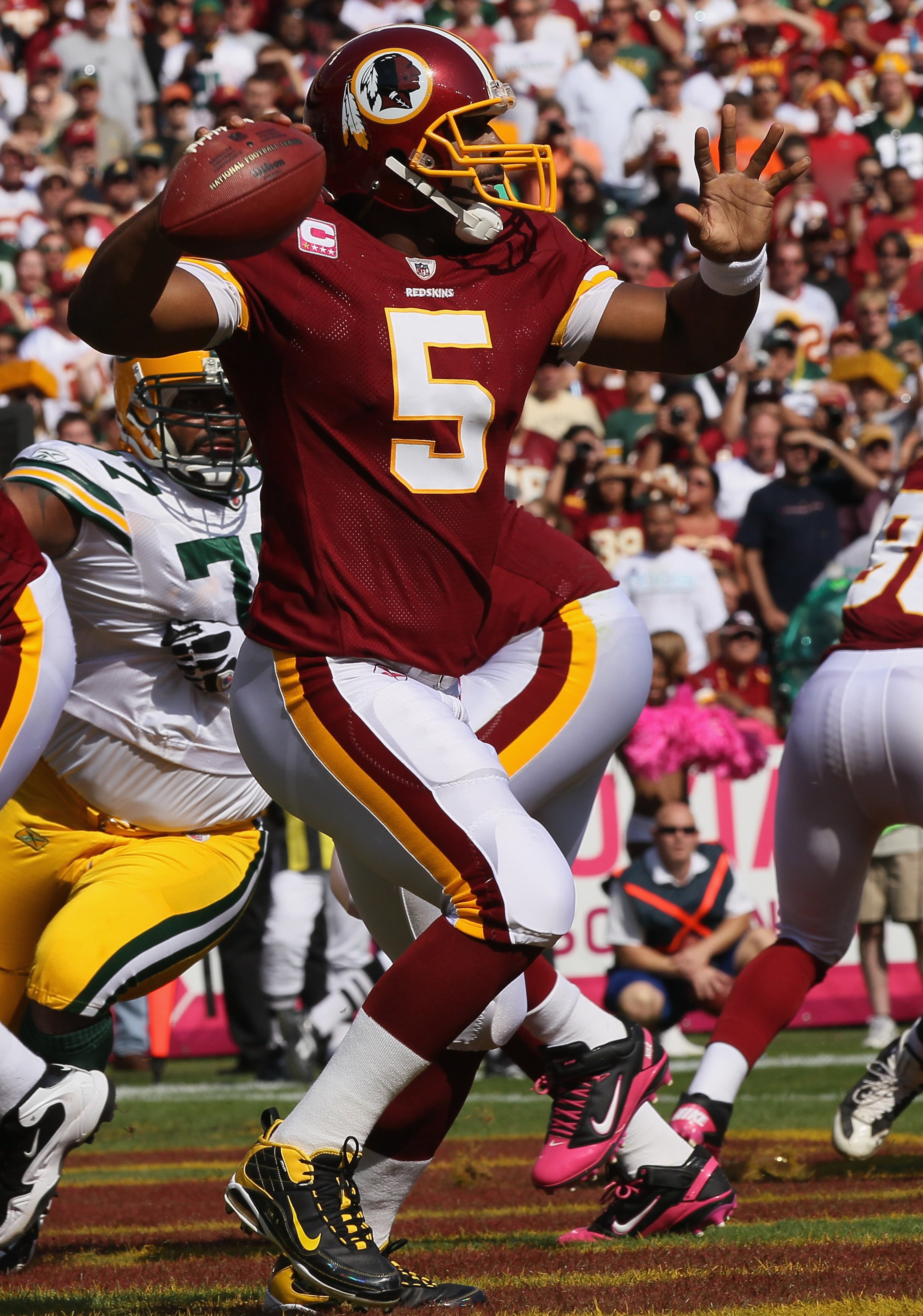 LANDOVER, MD - OCTOBER 10: Donovan McNabb #5 of the Washington Redskins drops back to pass against the Green Bay Packers at FedExField on October 10, 2010 in Landover, Maryland.  (Photo by Win McNamee/Getty Images)