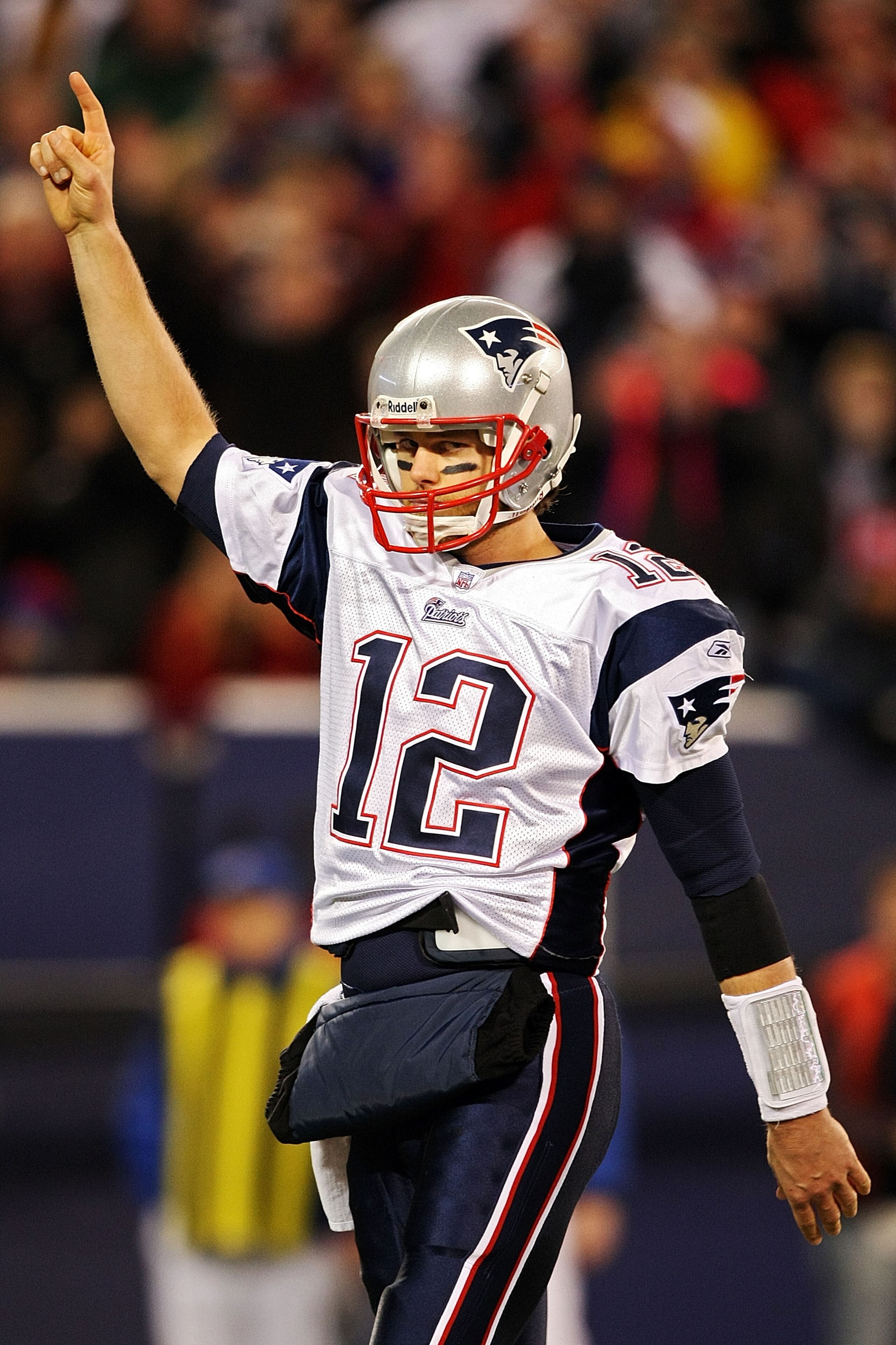 EAST RUTHERFORD, NJ - DECEMBER 29:  Tom Brady #12 of the New England Patriots celebrates after converting the two point conversion against the New York Giants on December 29, 2007 at Giants Stadium in East Rutherford, New Jersey.  (Photo by Al Bello/Getty