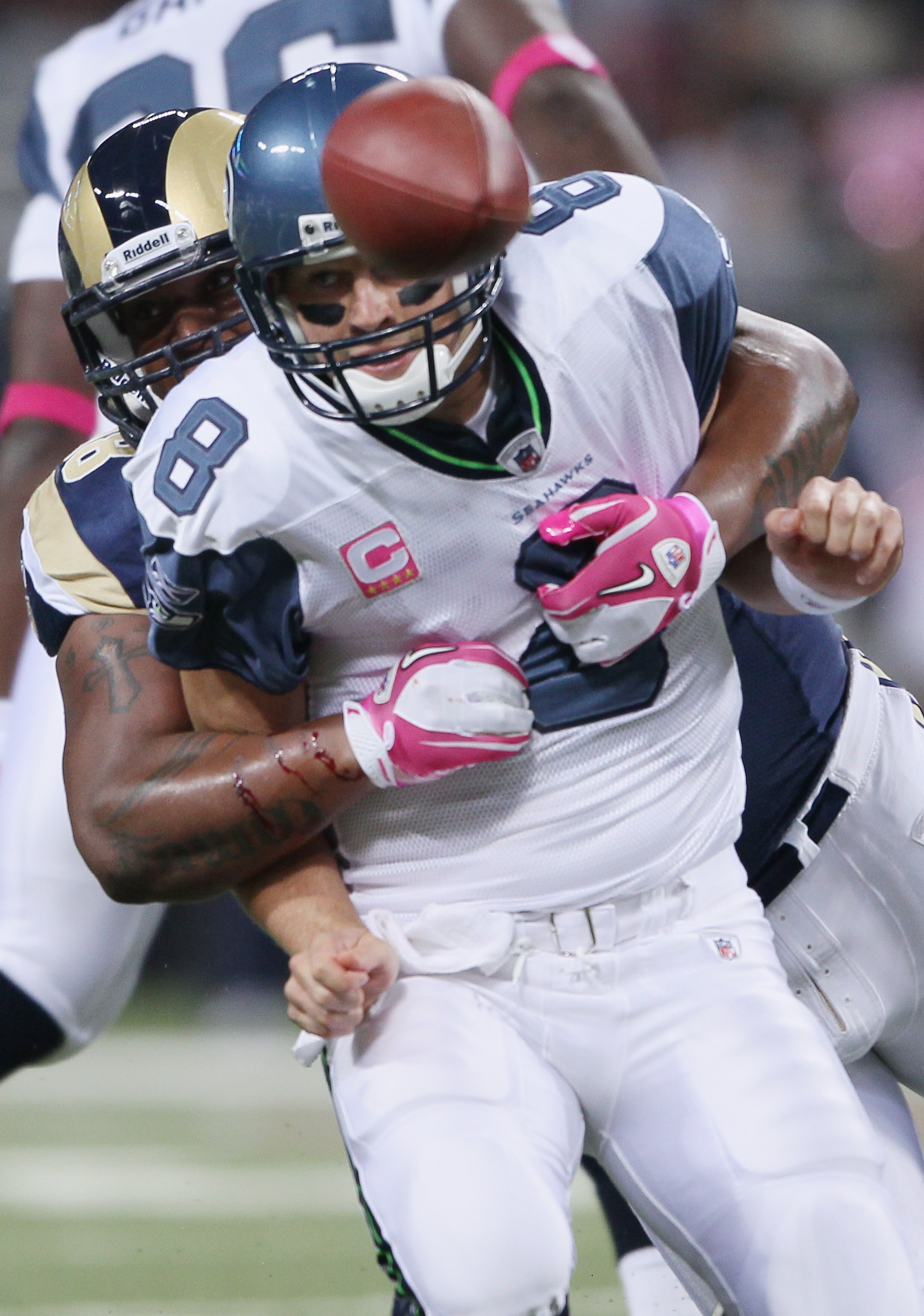 ST. LOUIS - OCTOBER 03: Fred Robbins #98 of the St. Louis Rams sacks Matt Hasselbeck #8 of the Seattle Seahawks on October 3, 2010 at Edward Jones Dome in St. Louis, Missouri.  (Photo by Elsa/Getty Images)