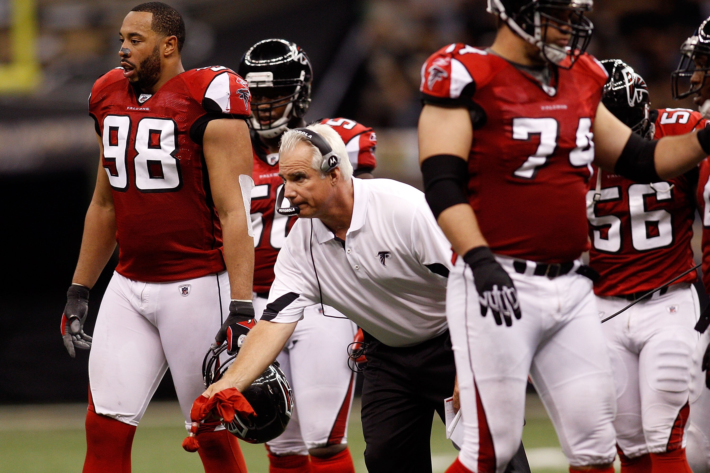 NEW ORLEANS - SEPTEMBER 26:  Head coach Mike Smith of the Atlanta Falcons throws out the red challenge flag during the game against the New Orleans Saints at the Louisiana Superdome on September 26, 2010 in New Orleans, Louisiana. The Falcons defeated the