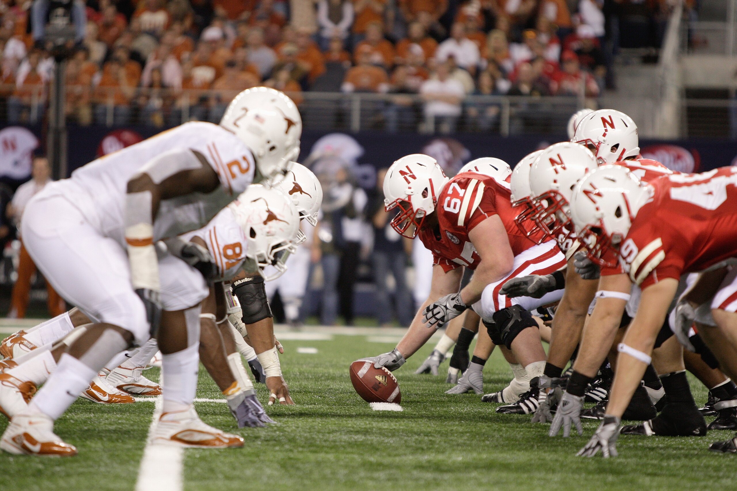 ARLINGTON, TX - DECEMBER 5: Sam Meginnis #67 of the Nebraska Cornhuskers gets ready to hike the ball during the Big 12 Football Championship game against the Texas Longhorns at Cowboys Stadium on December 5, 2009 in Arlington, Texas. (Photo by Jamie Squir