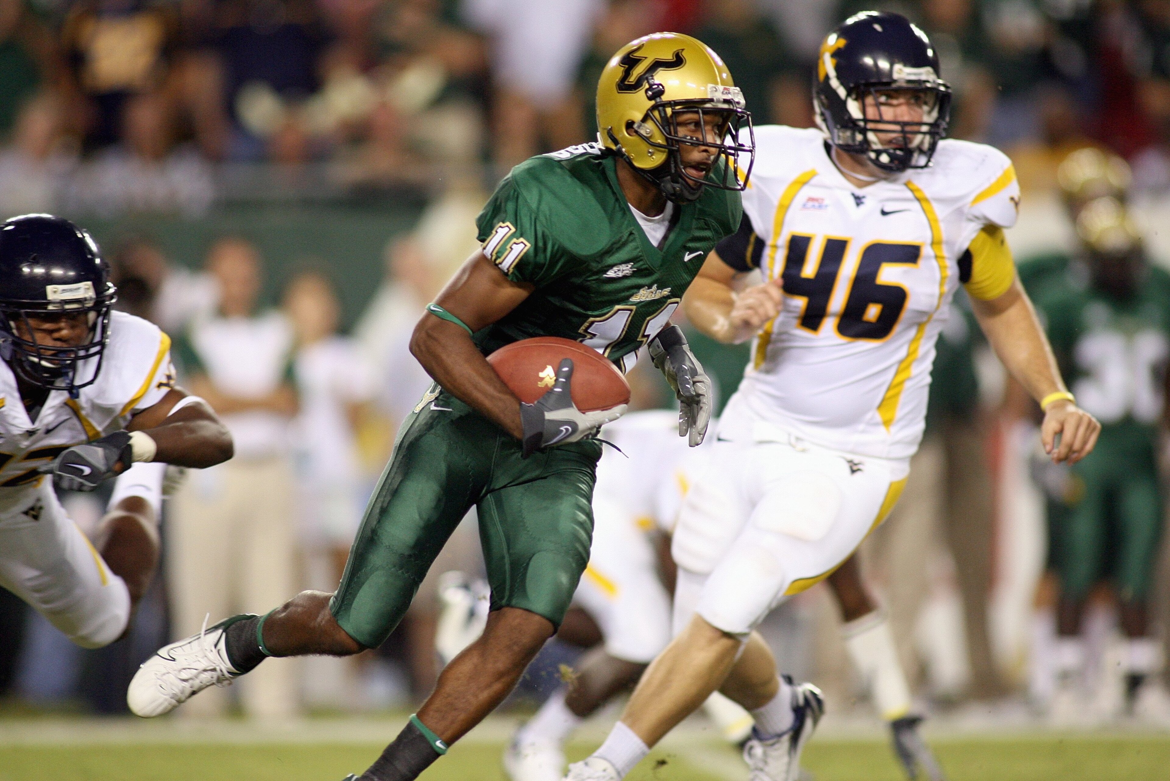 TAMPA, FL - SEPTEMBER 28: Marcus Edwards #11 of the University of South Florida Bulls carries the ball during the game against the West Virginia Mountaineers at Raymond James Stadium September 28, 2007 in Tampa Florida. (Photo by Marc Serota/Getty Images)