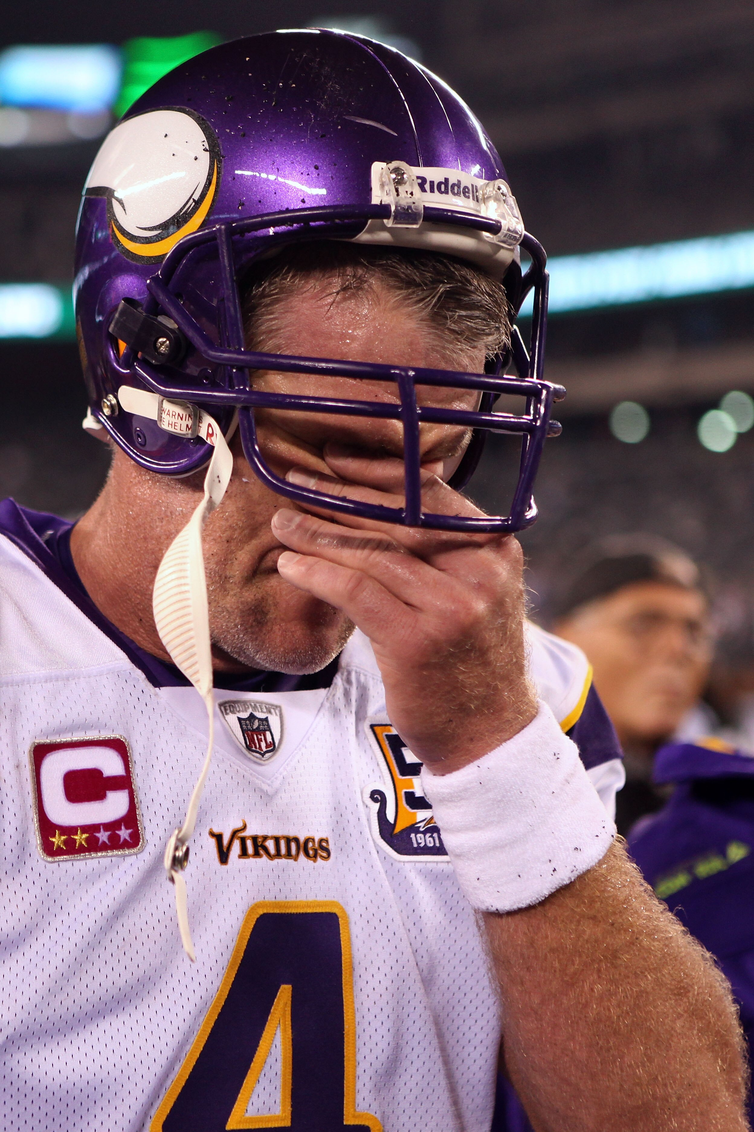 EAST RUTHERFORD, NJ - OCTOBER 11:  Brett Favre #4 of the Minnesota Vikings wipes his eyes as he walks off the field after the New York Jets won 29-20 at New Meadowlands Stadium on October 11, 2010 in East Rutherford, New Jersey.  (Photo by Andrew Burton/G