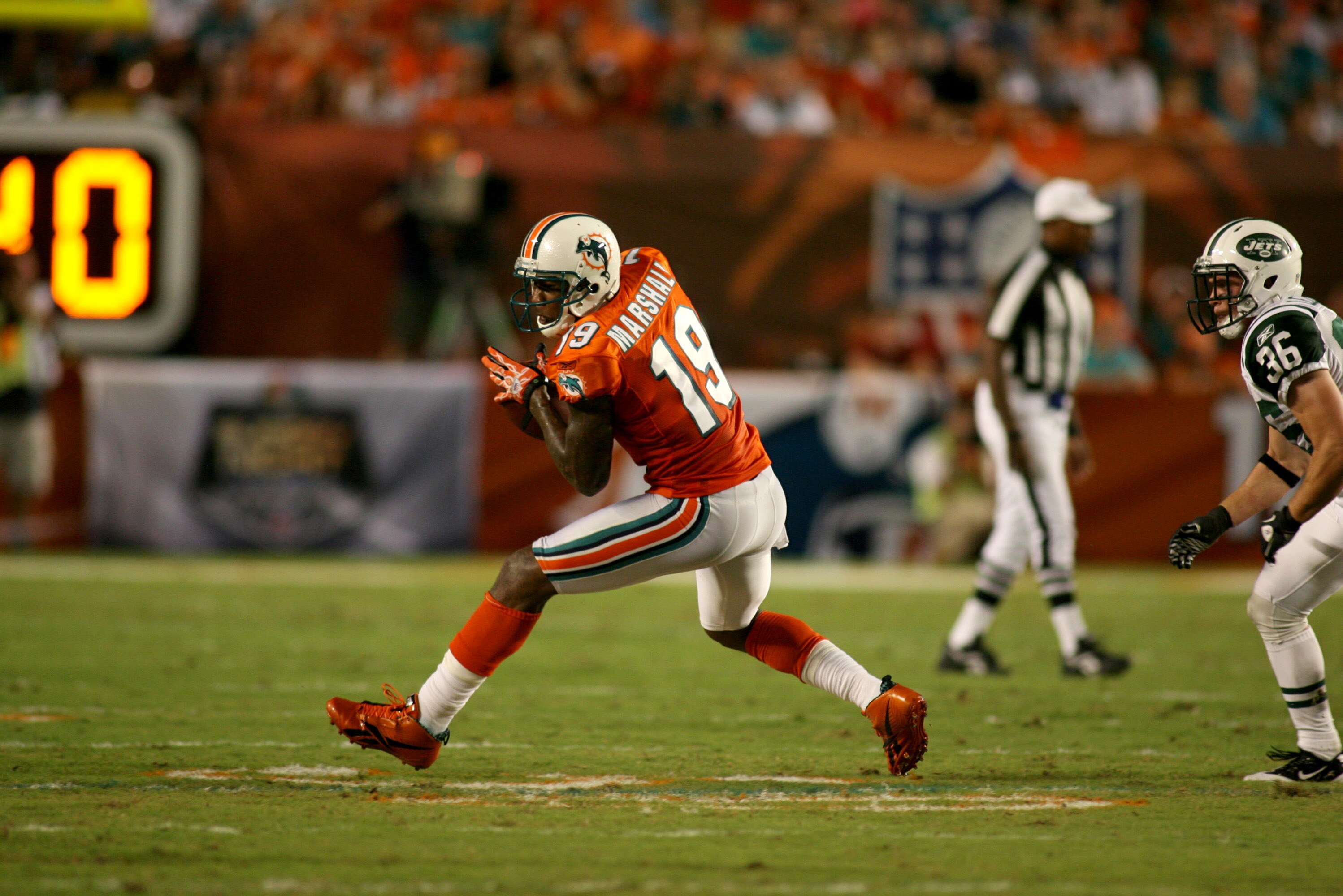 MIAMI - SEPTEMBER 26: Receiver Brandon Marshall #19 of the Miami Dolphins makes a catch against the New York Jets at Sun Life Stadium on September 26, 2010 in Miami, Florida. The Jets won 31-23. (Photo by Marc Serota/Getty Images)