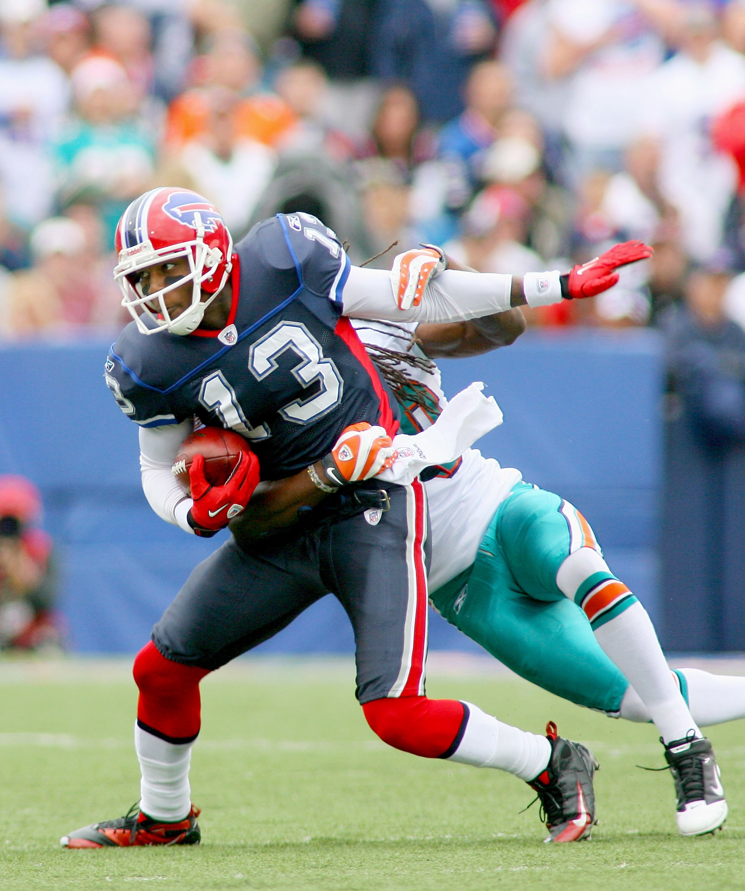 ORCHARD PARK, NY - SEPTEMBER 12: Steve Johnson #13 the Buffalo Bills tries to get away from Chris Clemons #30 of the Miami Dolphins during the NFL season opener at Ralph Wilson Stadium on September 12, 2010 in Orchard Park, New York. Miami won 15-10. (Pho