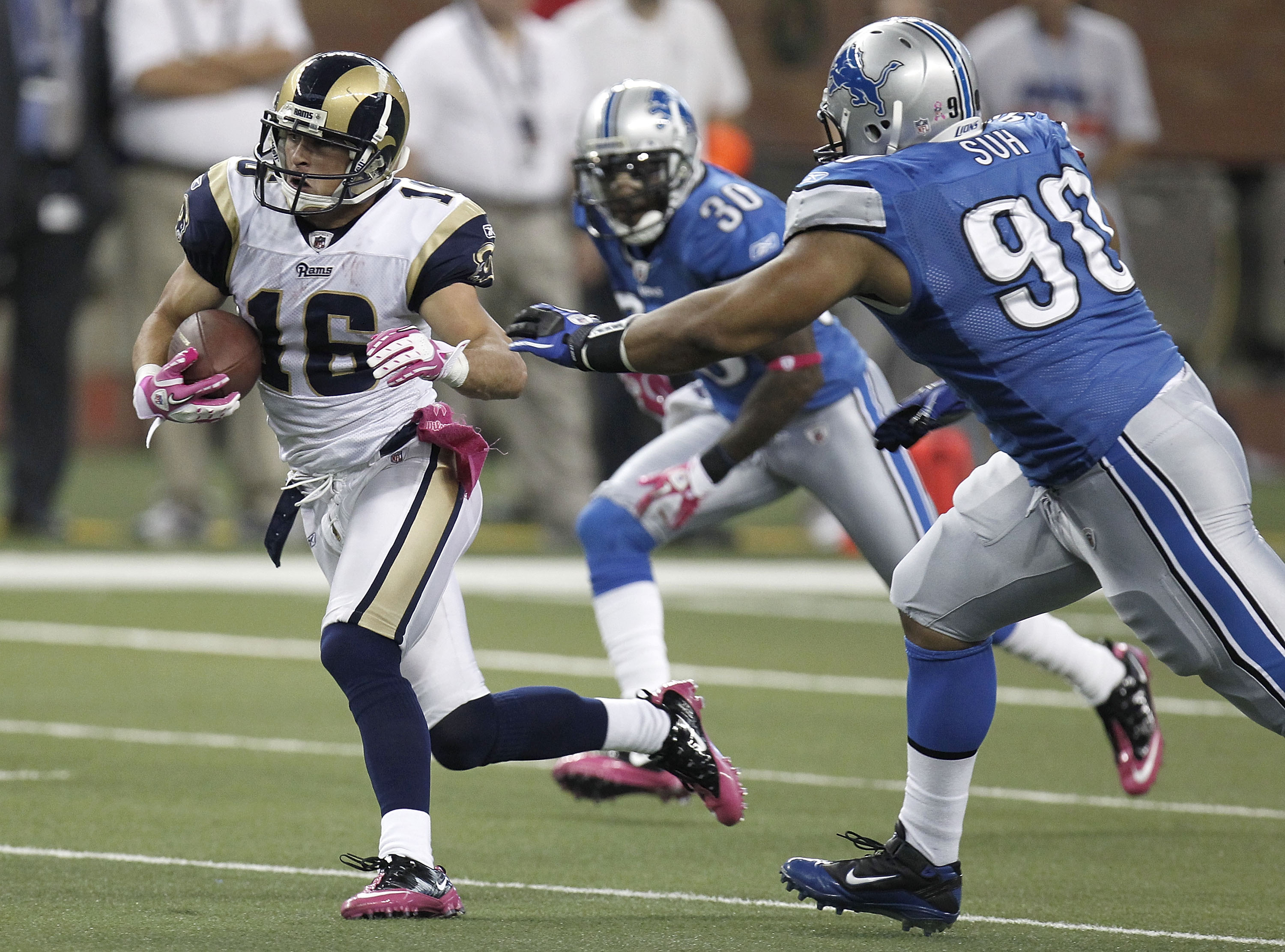 DETROIT - OCTOBER 10: Danny Amendola #16 of the St. Louis Rams tries to outrun the tackle of Ndamukong Suh #90 of the Detroit Lions on October 10, 2010 at Ford Field in Detroit, Michigan.  (Photo by Gregory Shamus/Getty Images)