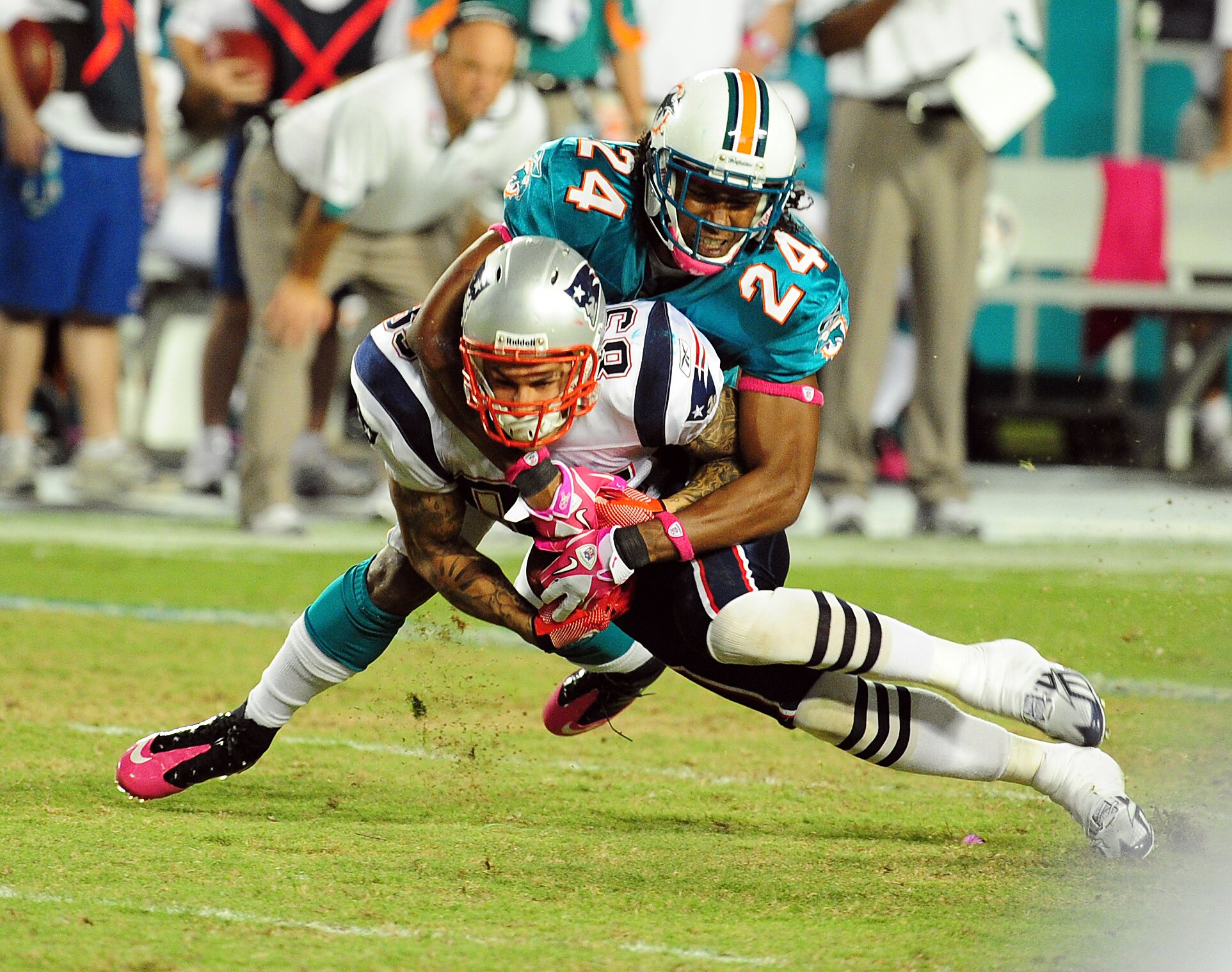 MIAMI - OCTOBER 4: Wes Welker #83 of the New England Patriots is tackled by Sean Smith #24 of the Miami Dolphins at Sun Life Field on October 4, 2010 in Miami, Florida. (Photo by Scott Cunningham/Getty Images)