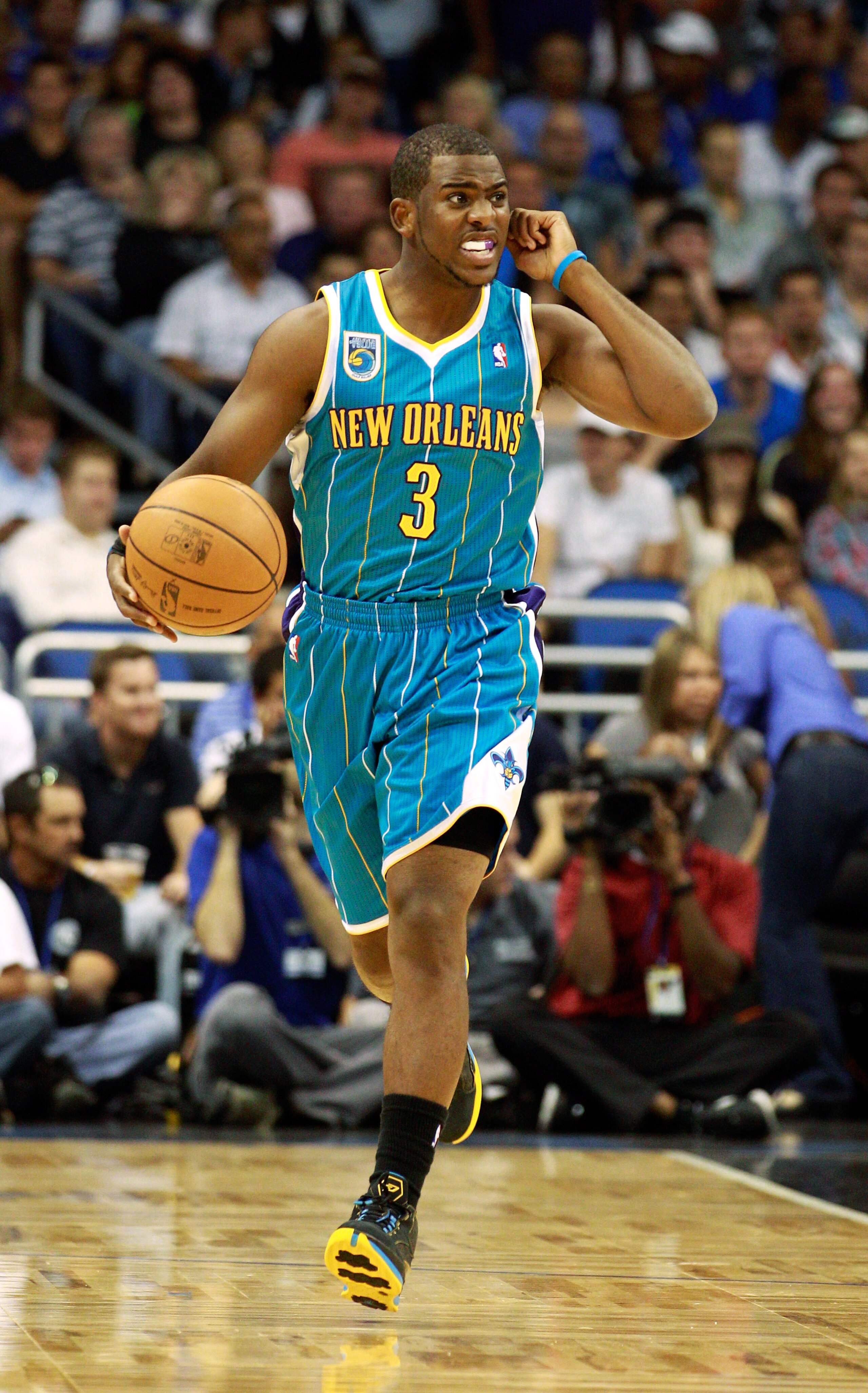 ORLANDO, FL - OCTOBER 10:  Chris Paul #3 of the New Orleans Hornets dribbles during the game against the Orlando Magic at Amway Arena on October 10, 2010 in Orlando, Florida. NOTE TO USER: User expressly acknowledges and agrees that, by downloading and or