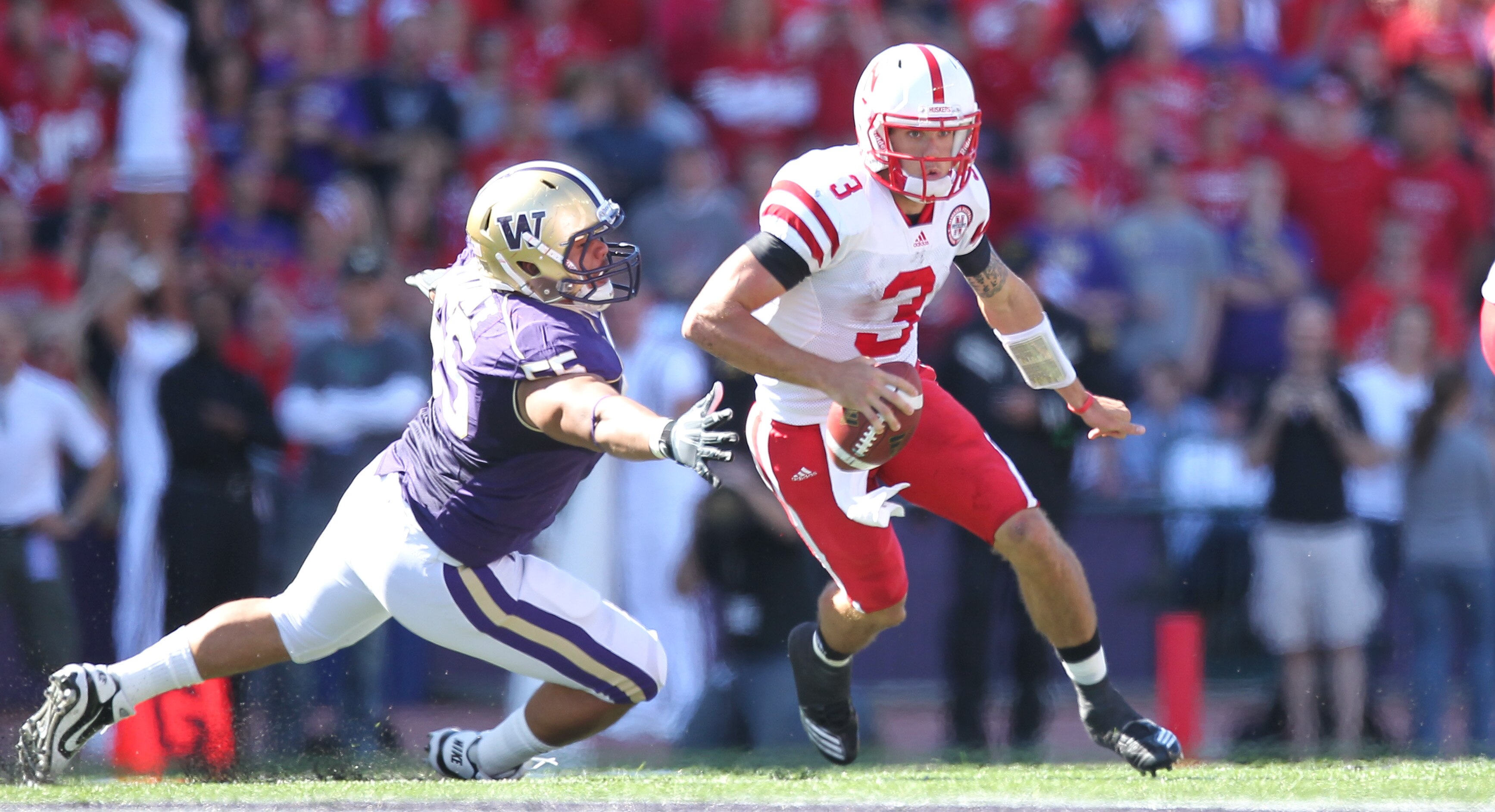 SEATTLE - SEPTEMBER 18: Quarterback Taylor Martinez #3 of the Nebraska Cornhuskers rushes against Sione Potoa'e #55 of the Washington Huskies on September 18, 2010 at Husky Stadium in Seattle, Washington. (Photo by Otto Greule Jr/Getty Images) SEATTLE - SEPTEMBER 18: Quarterback Taylor Martinez #3 of the Nebraska Cornhuskers rushes against Sione Potoa'e #55 of the Washington Huskies on September 18, 2010 at Husky Stadium in Seattle, Washington. (Photo by Otto Greule Jr/Getty Images)