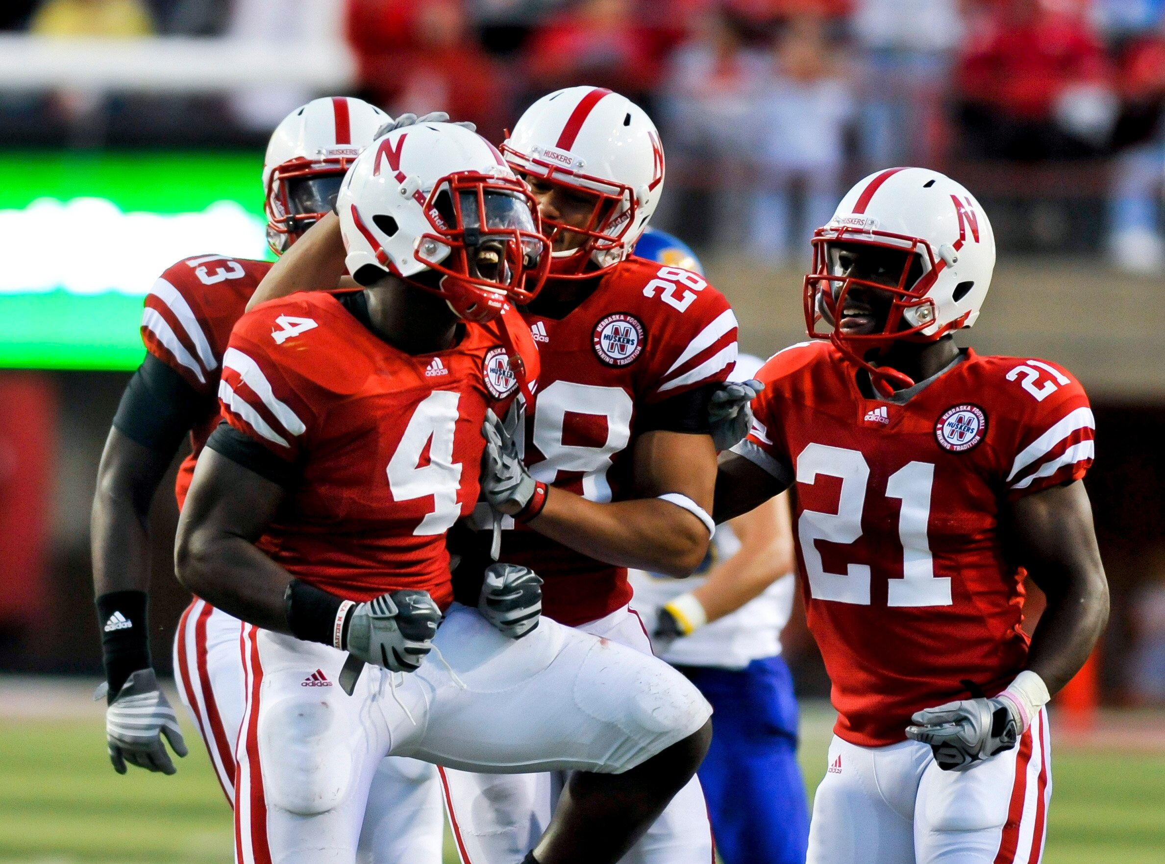 LINCOLN, NEBRASKA - SEPTEMBER 25: Nebraska Cornhuskers linebacker Lavonte David #4 celebrates a tackle with his teammates defensive back Eric Hagg #28 and Nebraska cornerback Prince Amukamara #21 during their game at Memorial Stadium on September 25, 201 LINCOLN, NEBRASKA - SEPTEMBER 25: Nebraska Cornhuskers linebacker Lavonte David #4 celebrates a tackle with his teammates defensive back Eric Hagg #28 and Nebraska cornerback Prince Amukamara #21 during their game at Memorial Stadium on September 25, 201