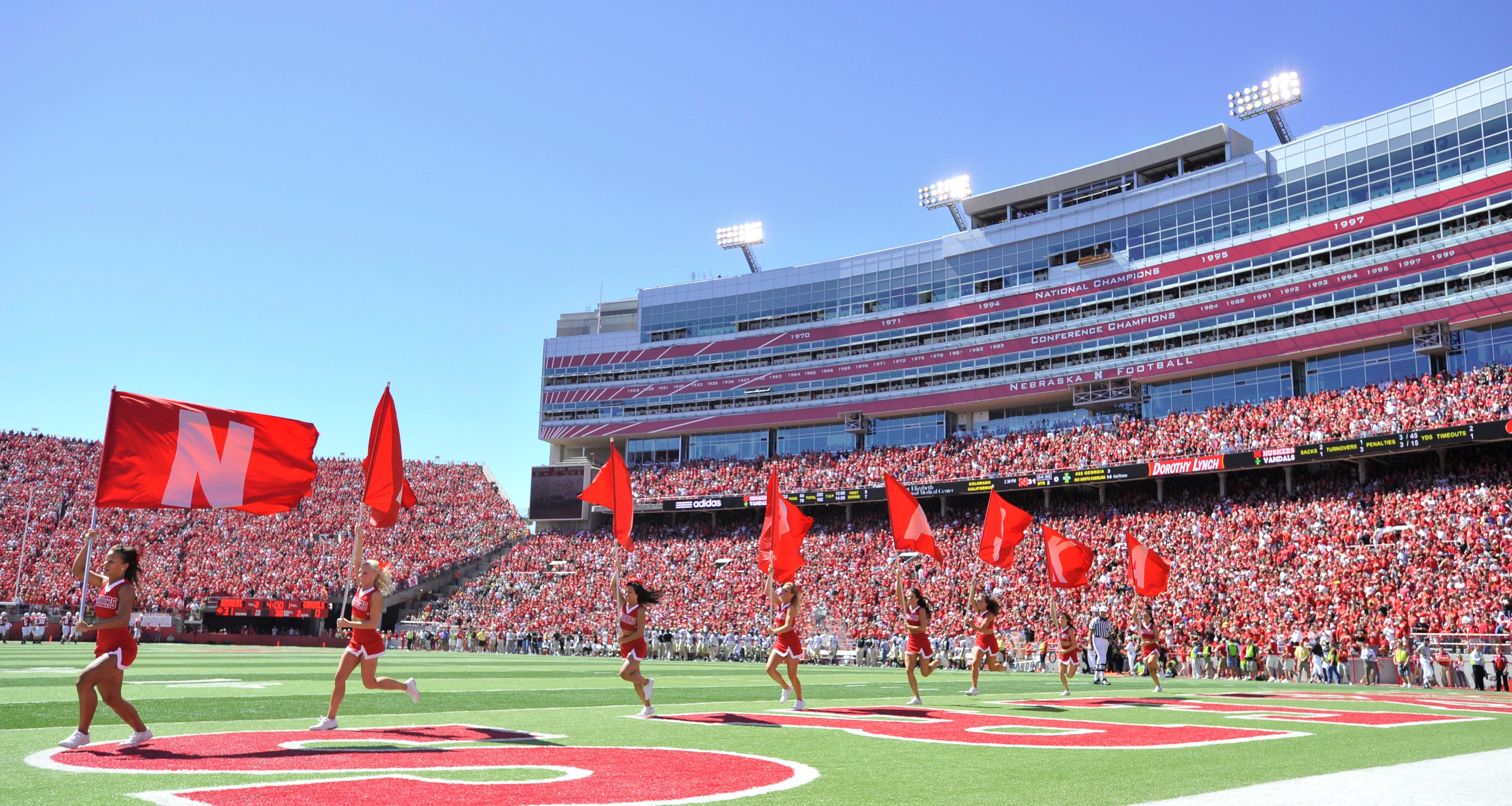 LINCOLN, NEBRASKA - SEPTEMBER 11: The Nebraska Cornhuskers flag corps celebrates a Nebraska touchdown during the second half of their football game between the Nebraska Cornhuskers and the Idaho Vandals at Memorial Stadium on September 4, 2010 in Lincoln, LINCOLN, NEBRASKA - SEPTEMBER 11: The Nebraska Cornhuskers flag corps celebrates a Nebraska touchdown during the second half of their football game between the Nebraska Cornhuskers and the Idaho Vandals at Memorial Stadium on September 4, 2010 in Lincoln,