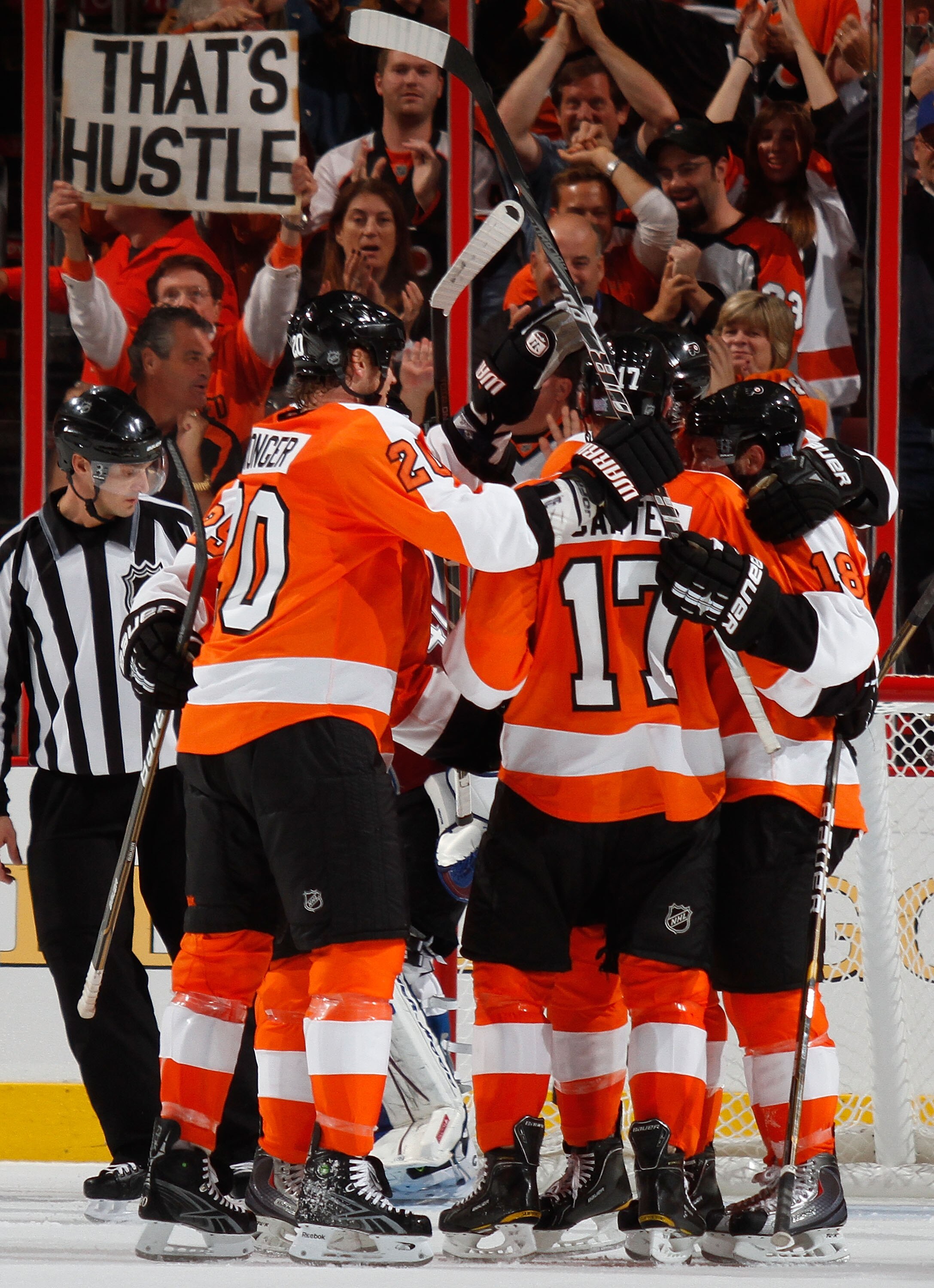 PHILADELPHIA - OCTOBER 11:  Teammates mob Jeff Carter #17 of the Philadelphia Flyers after he scored the Flyers winning goal in the third period of a hockey game against the Colorado Avalanche at the Wells Fargo Center on October 11, 2010 in Philadelphia,