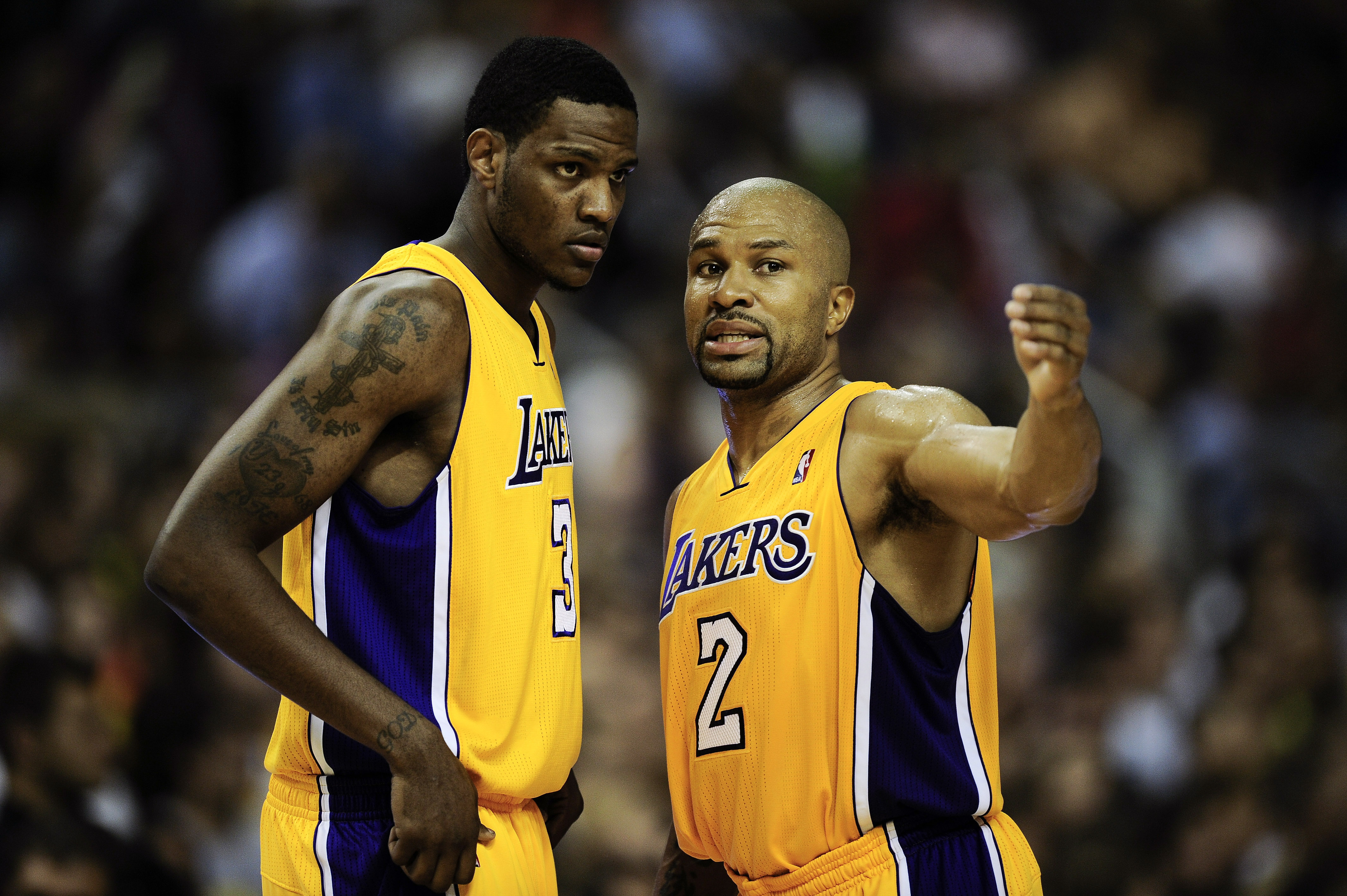 BARCELONA, SPAIN - OCTOBER 07:  Devin Ebanks (L) #3 of the Los Angeles Lakers chats with his teammate Derek Fisher #2 during the NBA Europe Live match between Los Angeles Lakers and Regal FC Barcelona at the at Palau Blaugrana on October 7, 2010 in Barcel