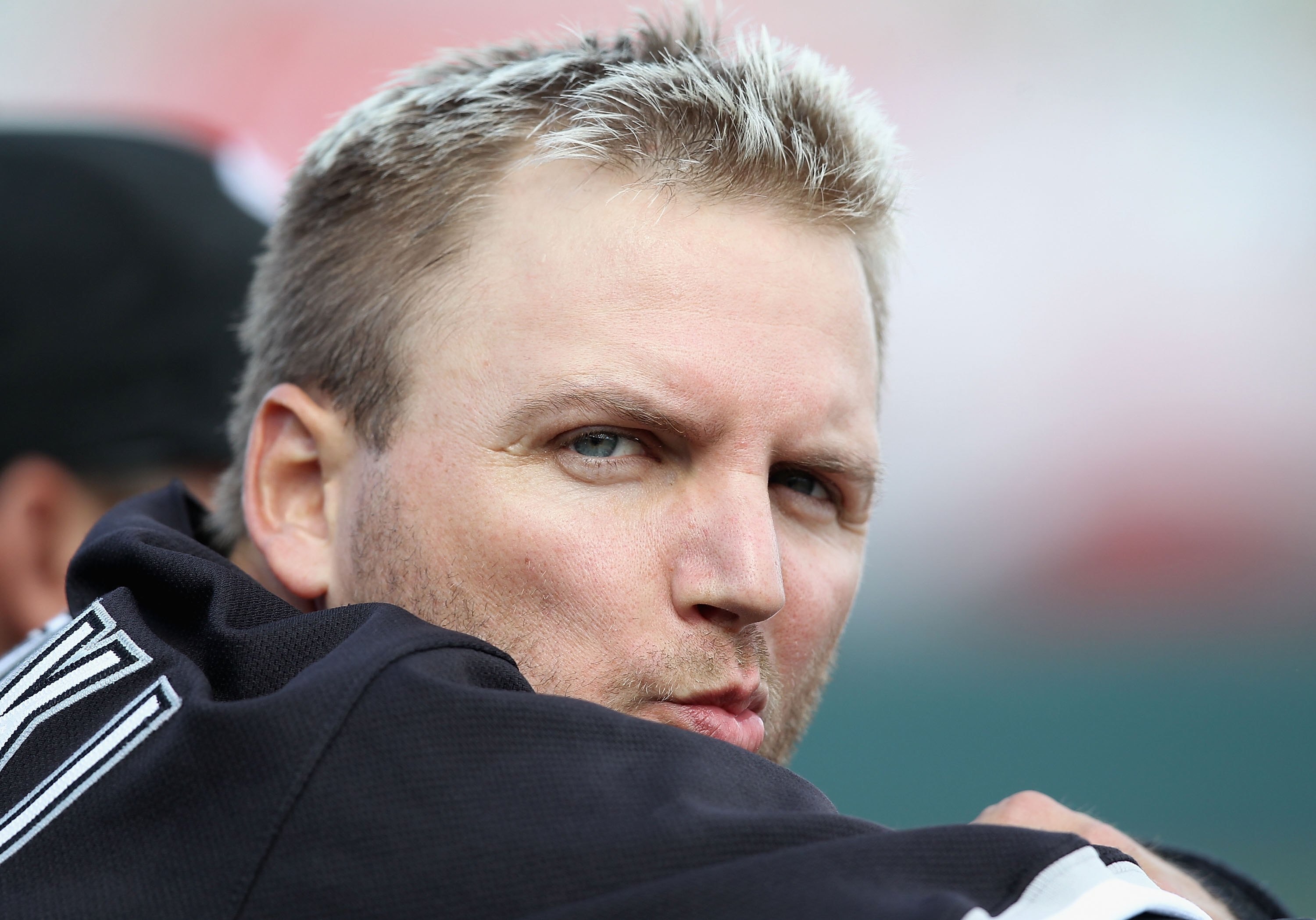 PHOENIX - MARCH 10:  A.J. Pierzynski #12 of the Chicago White Sox sits in the dugout during the MLB spring training game against the Oakland Athletics at Phoenix Municipal Stadium on March 10, 2010 in Phoenix, Arizona. The White Sox defeated the A's 9-5