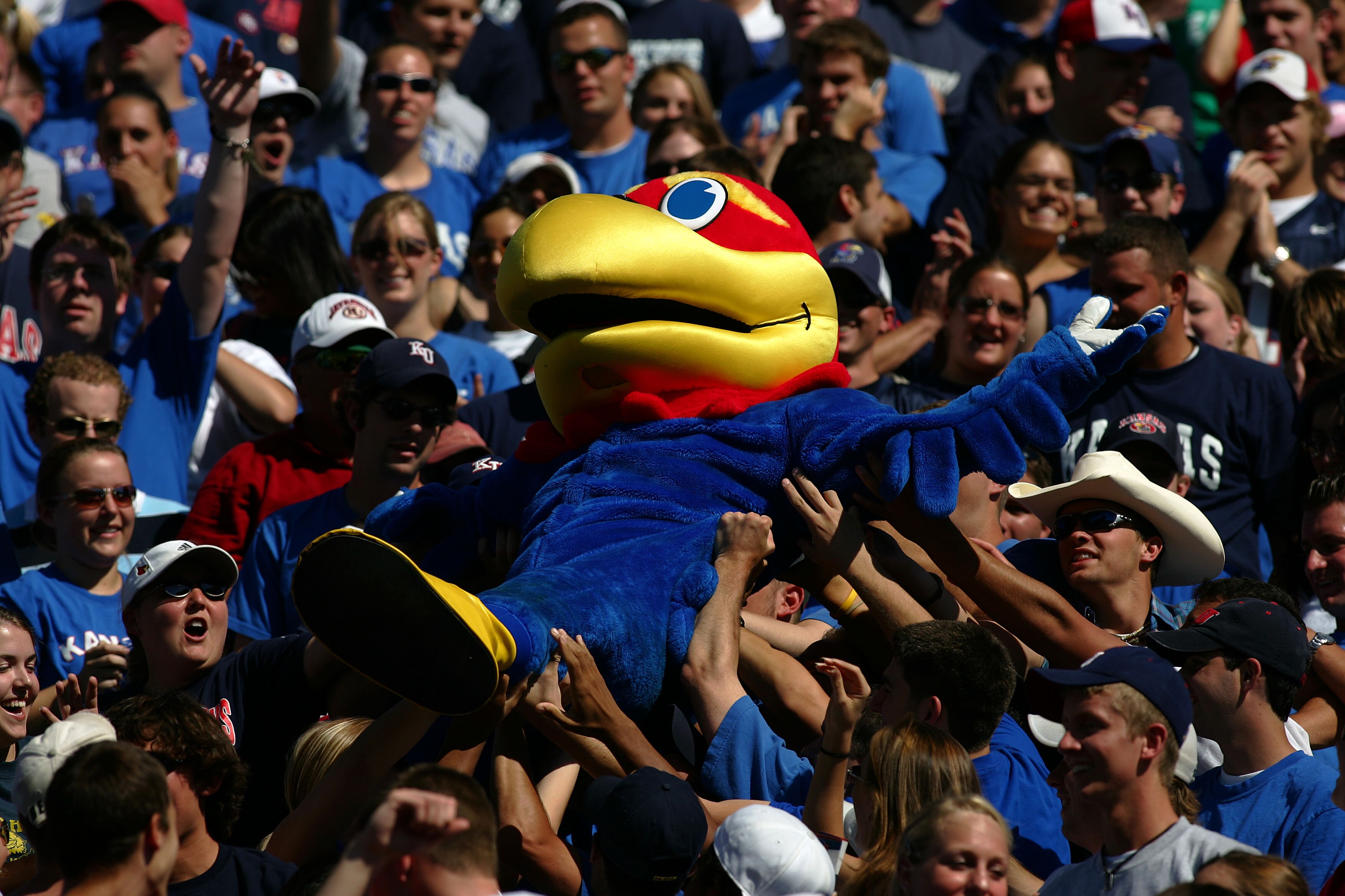 KANSAS CITY, MO - SEPTEMBER 25: The mascot of University of Kansas gets lifted through the stands after they scored a touchdown against Texas Tech in the first half at Memorial Stadium on September 25, 2004 in Kansas City, Missouri. (Photo by Donald Miral