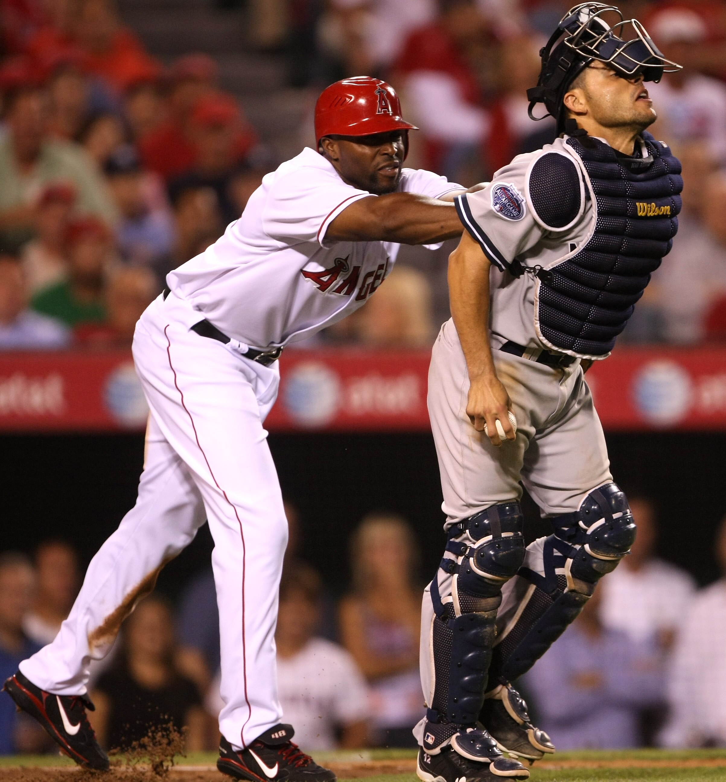 ANAHEIM, CA - SEPTEMBER 08:  Torii Hunter #48 of the Los Angeles Angels of Anaheim pushes catcher Ivan Rodriguez of the New York Yankees after being tagged out on September 8, 2008 at Angel Stadium in Anaheim, California.  The action triggered a dugout cl