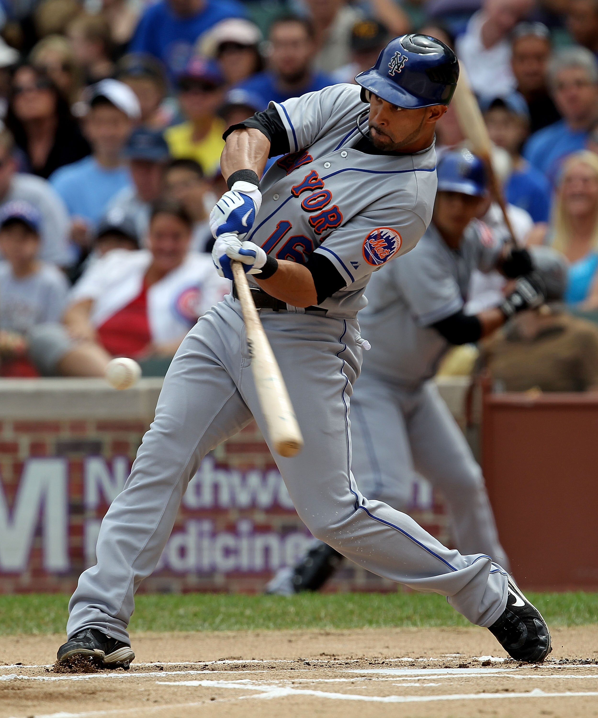 CHICAGO - SEPTEMBER 05: Angel Pagan #16 of the New York Mets takes a swing against the Chicago Cubs at Wrigley Field on September 5, 2010 in Chicago, Illinois. The Mets defeated the Cubs 18-5.  (Photo by Jonathan Daniel/Getty Images)