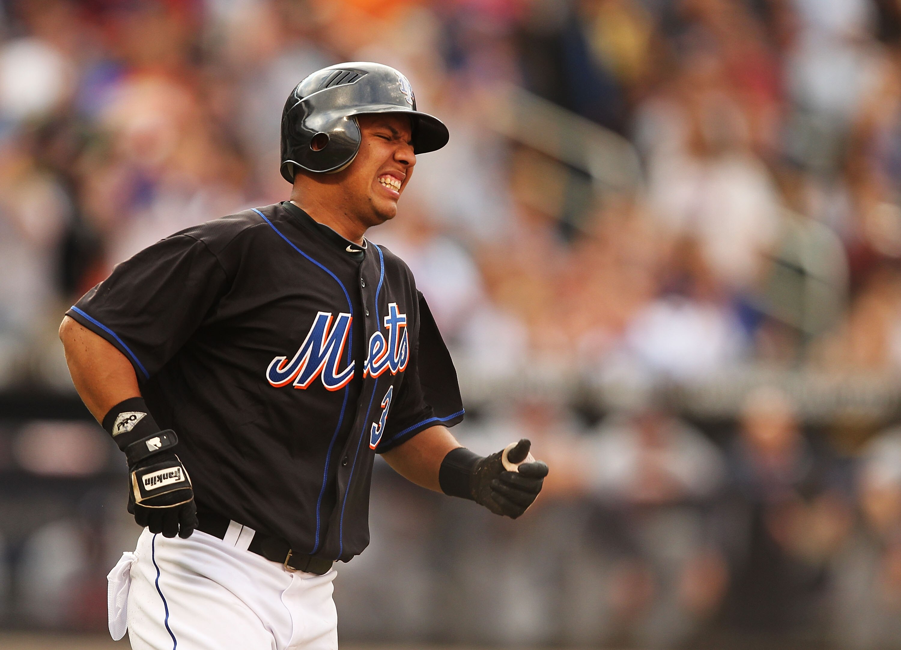NEW YORK - SEPTEMBER 18:  Luis Hernandez #3 of the New York Mets winces in pain while rounding the bases after hitting a home run against  the Atlanta Braves in the fifth inning during their game on September 18, 2010 at Citi Field in the Flushing neighbo