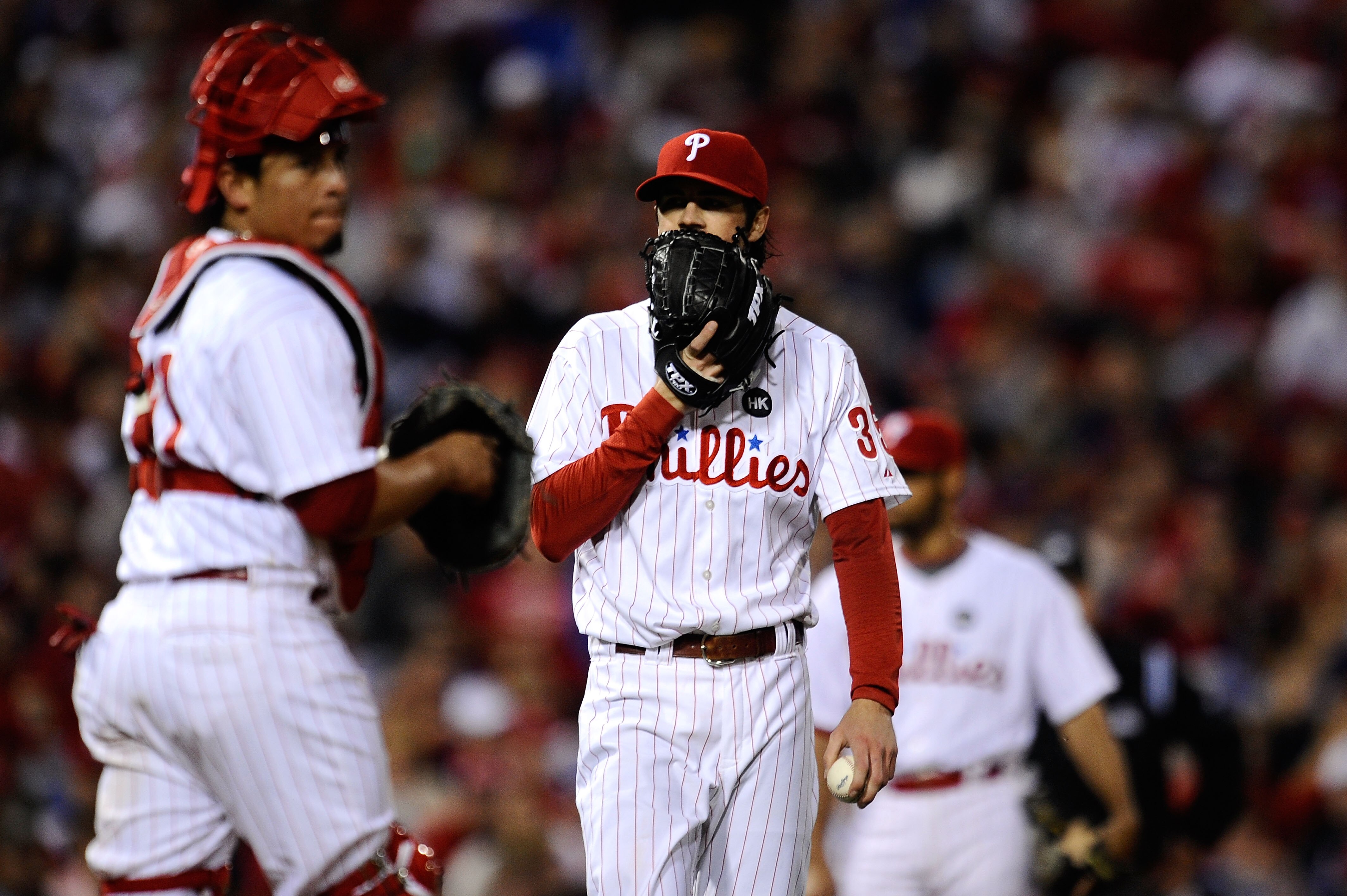 PHILADELPHIA - OCTOBER 21:  Cole Hamels #35 of of the Philadelphia Phillies talks to Carlos Ruiz #51 during their game against the Los Angeles Dodgers in Game Five of the NLCS during the 2009 MLB Playoffs at Citizens Bank Park on October 21, 2009 in Phila