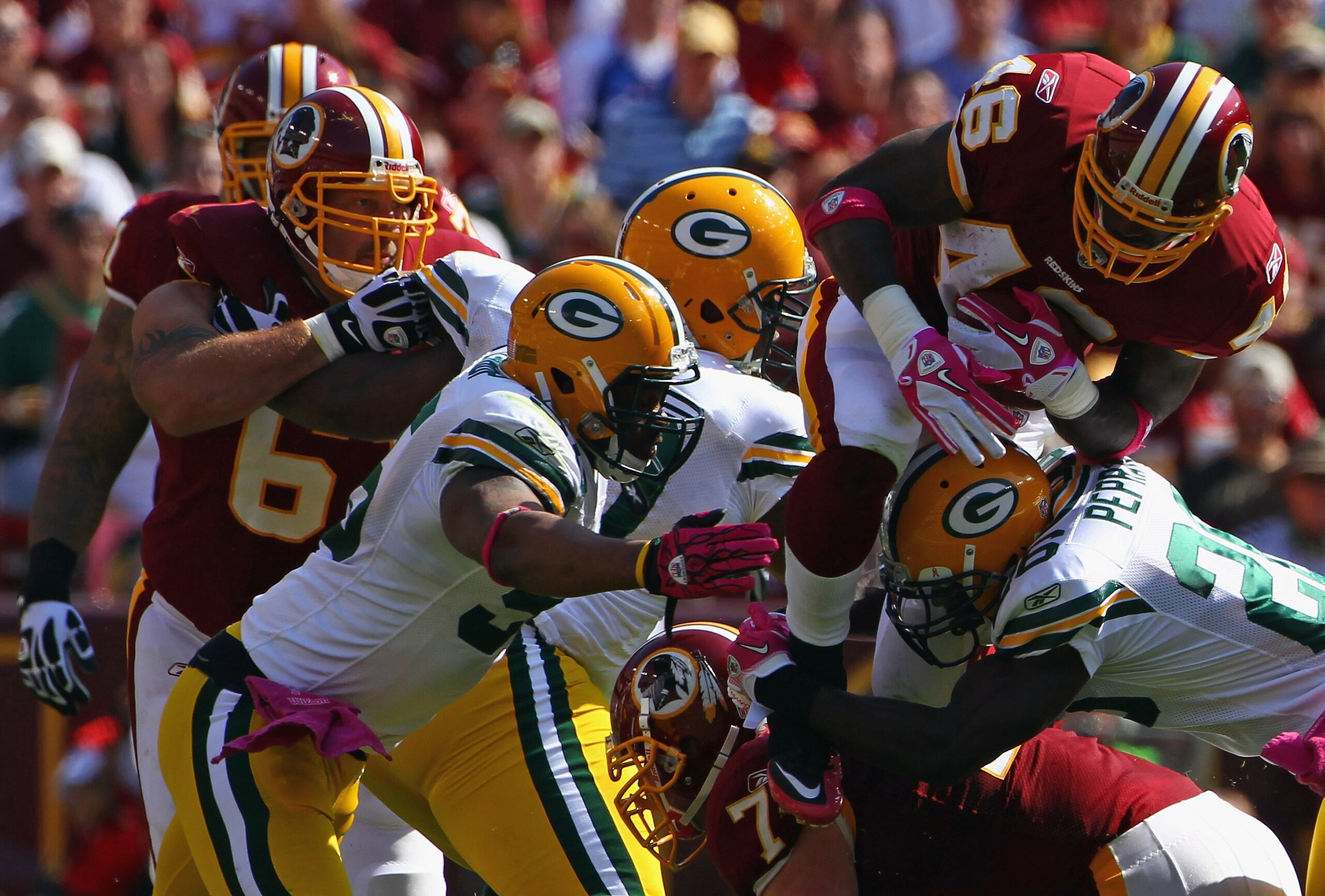 LANDOVER, MD - OCTOBER 10: Running back Ryan Torain #46 of the Washington Redskins is swarmed by the Green Bay Packers defense at FedExField on October 10, 2010 in Landover, Maryland.  (Photo by Win McNamee/Getty Images)