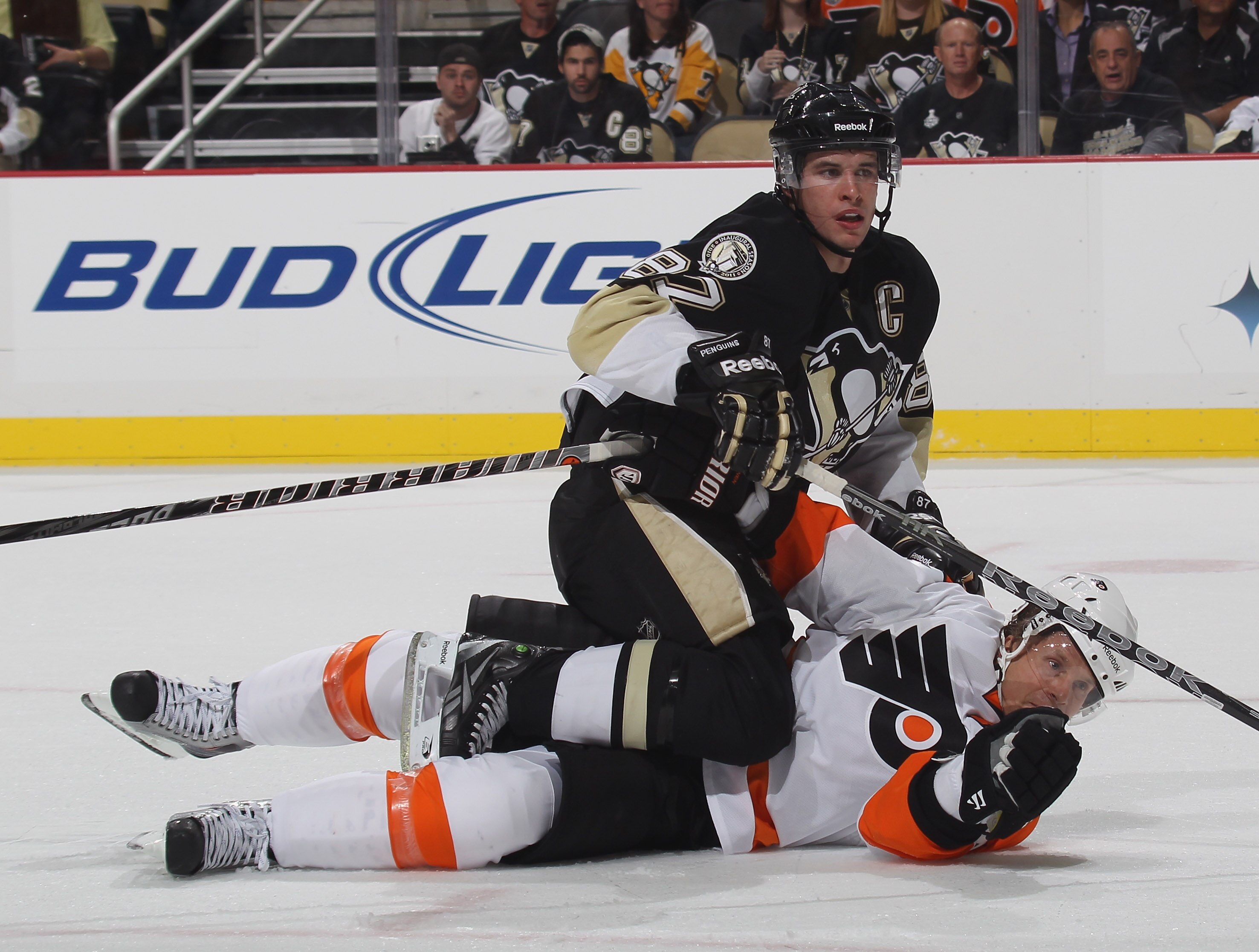 PITTSBURGH - OCTOBER 07:  Sidney Crosby #87 of the Pittsburgh Penguins is stopped by Kimmo Timonen #44 of the Philadelphia Flyers at the Consol Energy Center on October 7, 2010 in Pittsburgh, Pennsylvania. The Flyers defeated the Penguins 3-2.  (Photo by