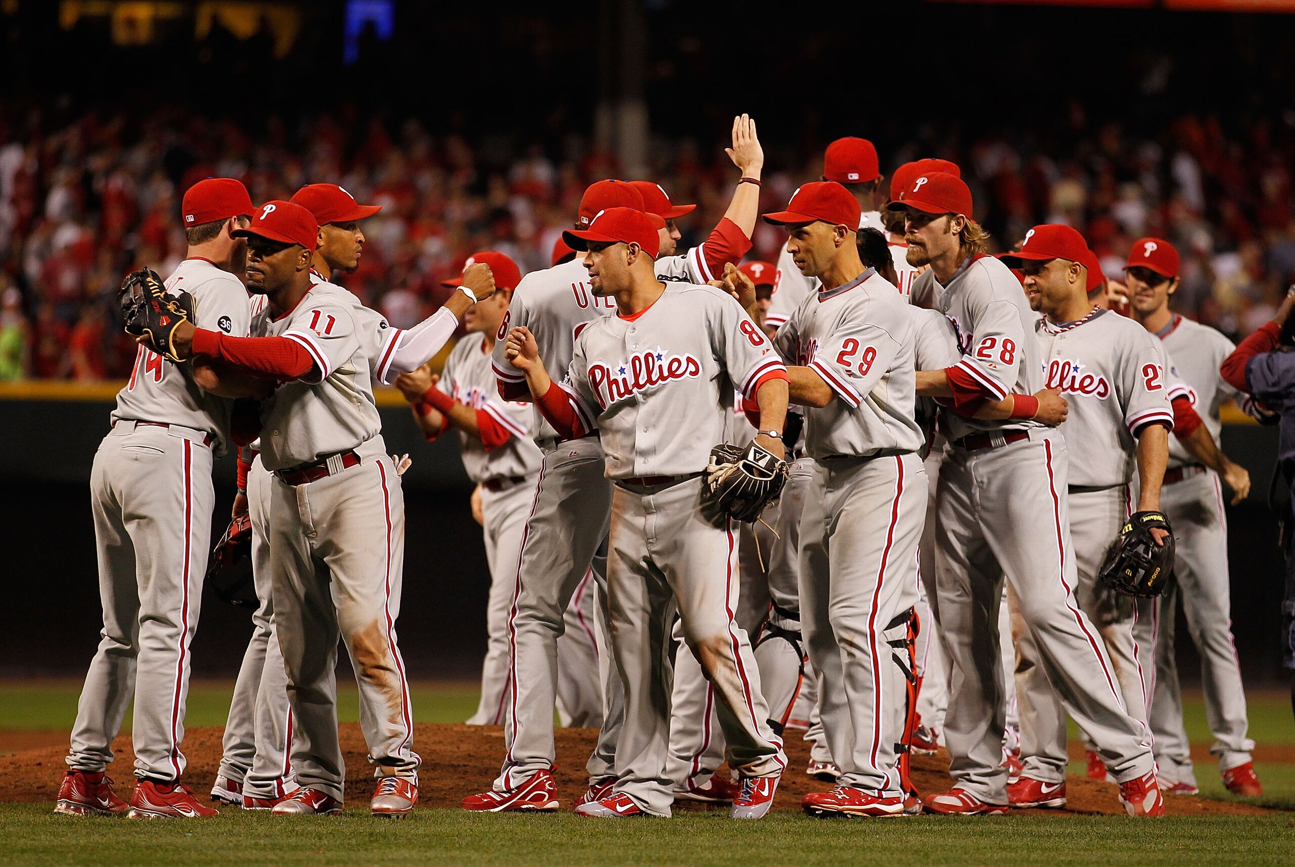 CINCINNATI - OCTOBER 10: Members of the Philadelphia Phillies including Jimmy Rollins #11, Shane Victorino #8, Raul Ibanez #29, Jayson Werth #28 and Placido Polanco #27 celebrate a three game sweep of the Cincinnati Reds following game 3 of the NLDS at Gr