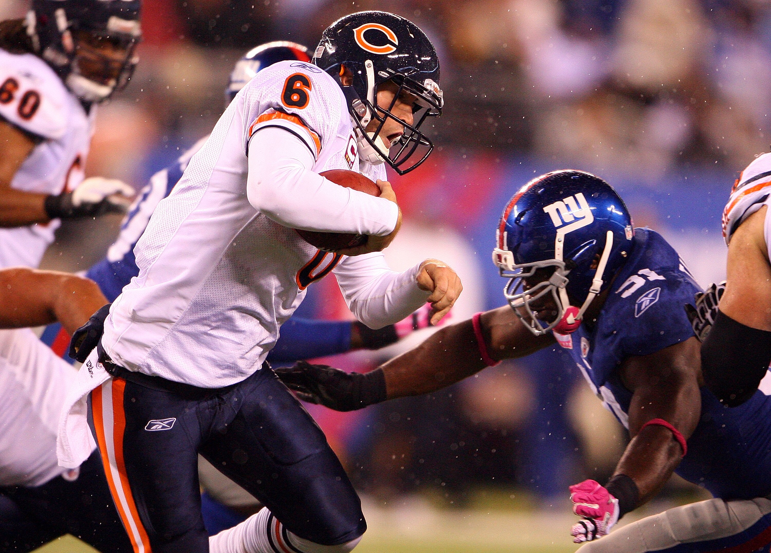EAST RUTHERFORD, NJ - OCTOBER 03:  Jay Cutler #6 of the Chicago Bears gets sacked by Justin Tuck #91 of the New York Giants at New Meadowlands Stadium on October 3, 2010 in East Rutherford, New Jersey.  (Photo by Andrew Burton/Getty Images)