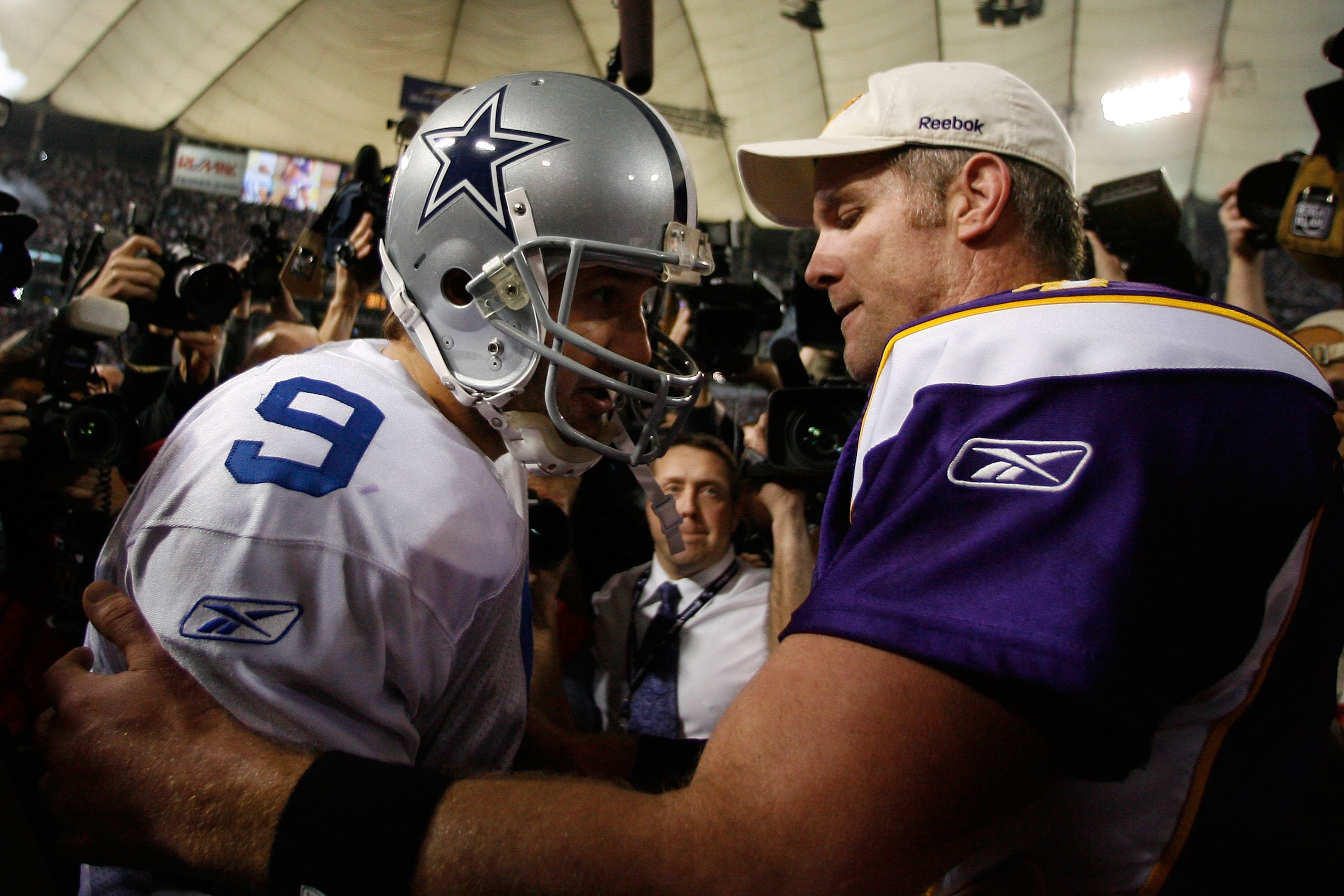 MINNEAPOLIS - JANUARY 17:  Quarterback Tony Romo #9 of the Dallas Cowboys congratulates quarterback Brett Favre #4 of the Minnesota Vikings on their 34-3 victory during the NFC Divisional Playoff Game at Hubert H. Humphrey Metrodome on January 17, 2010 in