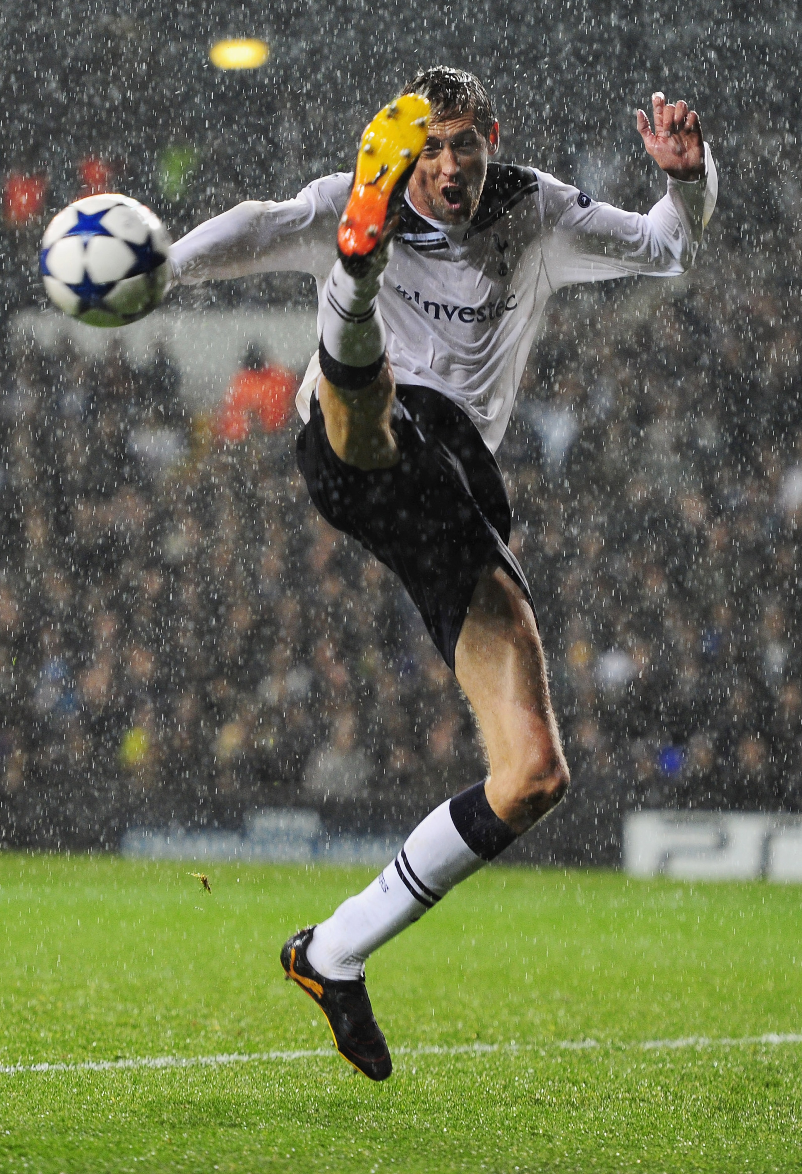 LONDON, ENGLAND - SEPTEMBER 29:  Peter Crouch of Tottenham attempts to control the ball in the rain during the  UEFA Champions League Group A match between Tottenham Hotspur and FC Twente at White Hart Lane on September 29, 2010 in London, England.  (Phot