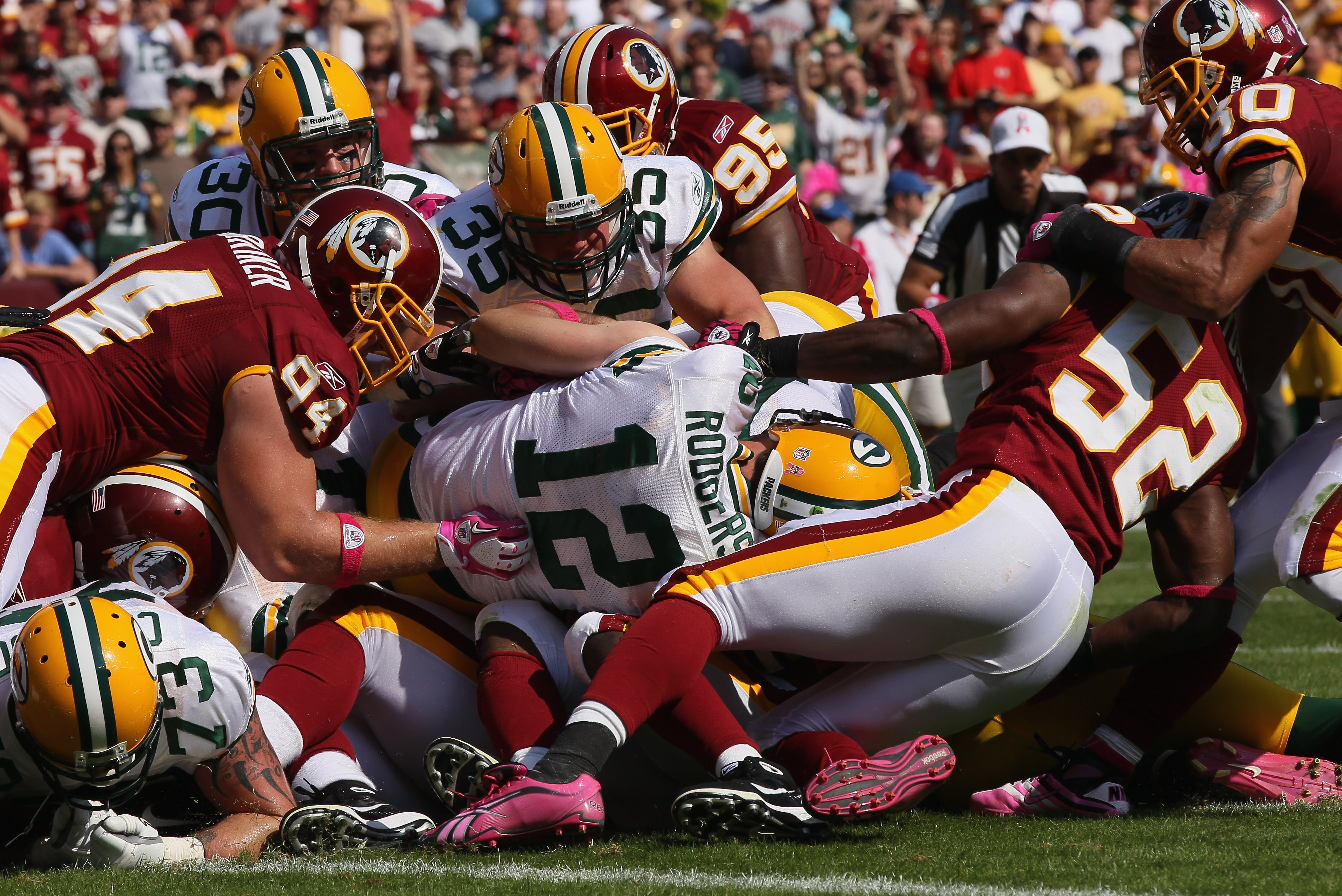 LANDOVER, MD - OCTOBER 10: Members of the Washington Redskins defense stop Green Bay Packers quarterback Aaron Rodgers #12 on third down and goal at FedExField on October 10, 2010 in Landover, Maryland. (Photo by Win McNamee/Getty Images) LANDOVER, MD - OCTOBER 10: Members of the Washington Redskins defense stop Green Bay Packers quarterback Aaron Rodgers #12 on third down and goal at FedExField on October 10, 2010 in Landover, Maryland. (Photo by Win McNamee/Getty Images)