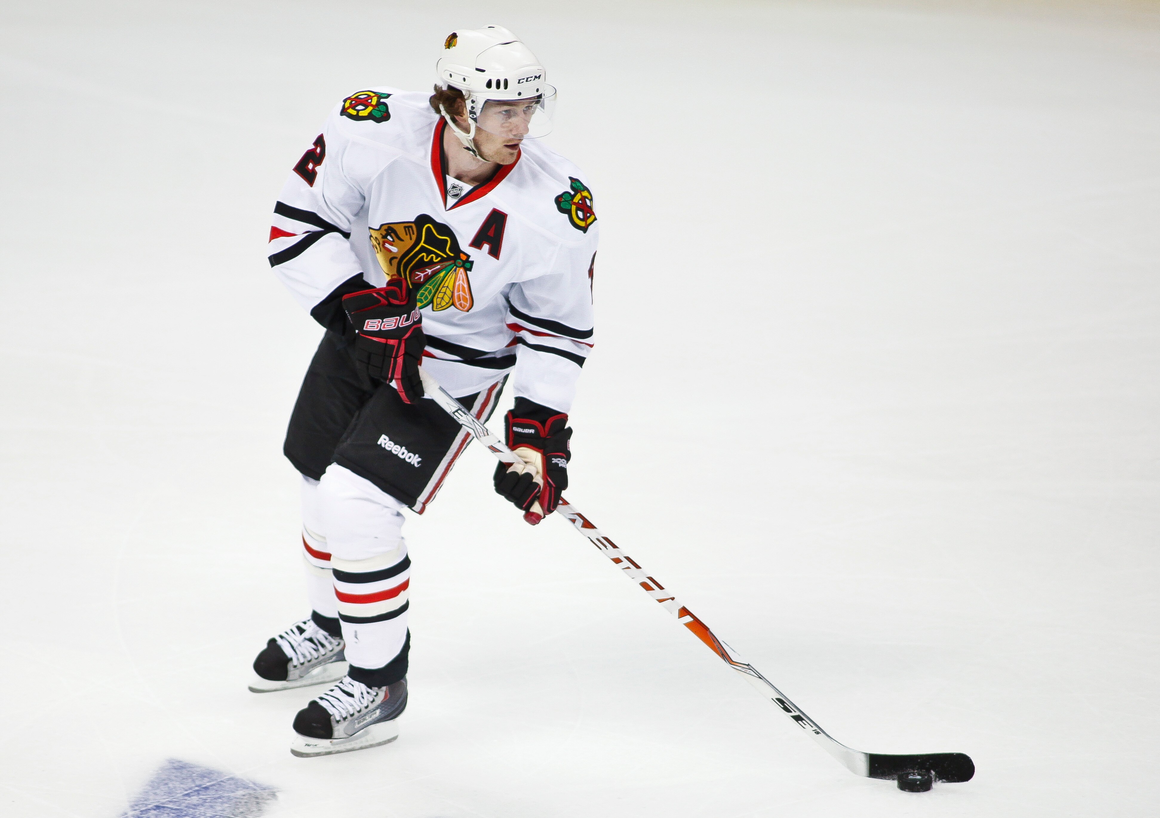 DENVER, CO - OCTOBER 7: Duncan Keith #2 of the Chicago Blackhawks handles the puck against the Colorado Avalanche during both team's season openers at the Pepsi Center on October 7, 2010 in Denver, Colorado. (Photo by Marc Piscotty/Getty Images)