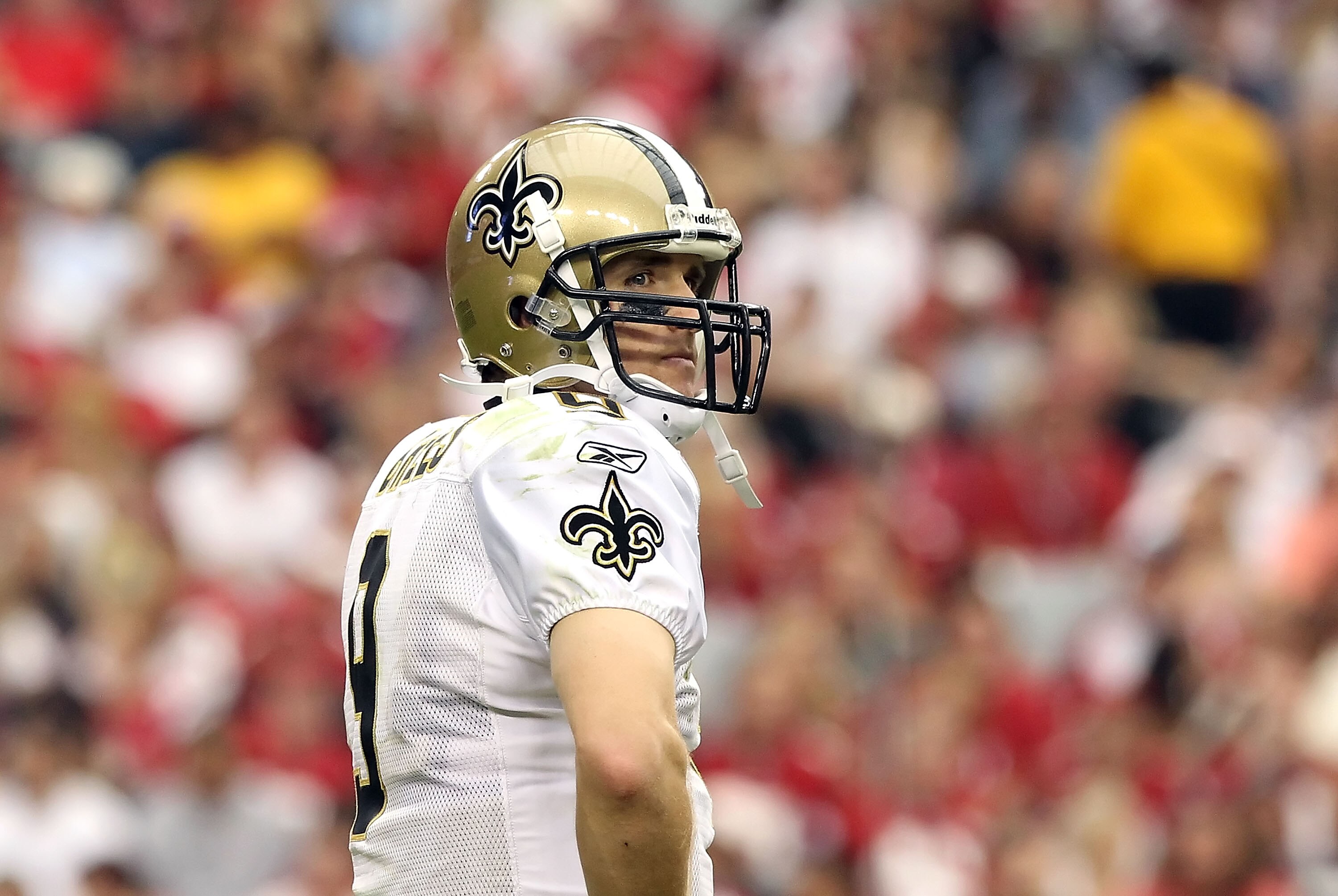 GLENDALE, AZ - OCTOBER 10: Quarterback Drew Brees #9 of the New Orleans Saints looks over to the bench during the NFL game against the Arizona Cardinals at the University of Phoenix Stadium on October 10, 2010 in Glendale, Arizona. The Cardinals defeated GLENDALE, AZ - OCTOBER 10: Quarterback Drew Brees #9 of the New Orleans Saints looks over to the bench during the NFL game against the Arizona Cardinals at the University of Phoenix Stadium on October 10, 2010 in Glendale, Arizona. The Cardinals defeated