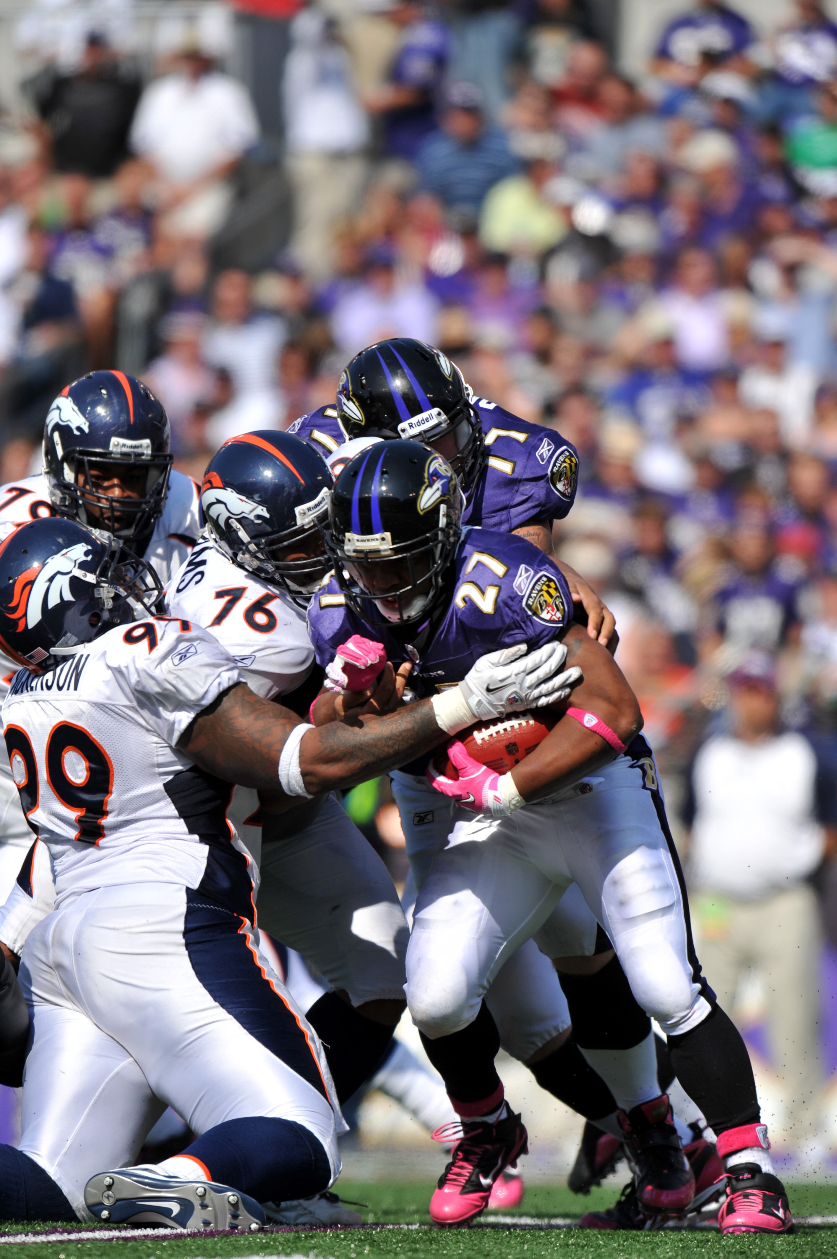 BALTIMORE, MD - OCTOBER 10: Ray Rice #27 of the Baltimore Ravens runs the ball against the Denver Broncos at M&T Bank Stadium on October 10, 2010 in Baltimore, Maryland. Players wore pink in recognition of Breast Cancer Awareness Month. The Ravens lead t BALTIMORE, MD - OCTOBER 10: Ray Rice #27 of the Baltimore Ravens runs the ball against the Denver Broncos at M&T Bank Stadium on October 10, 2010 in Baltimore, Maryland. Players wore pink in recognition of Breast Cancer Awareness Month. The Ravens lead t