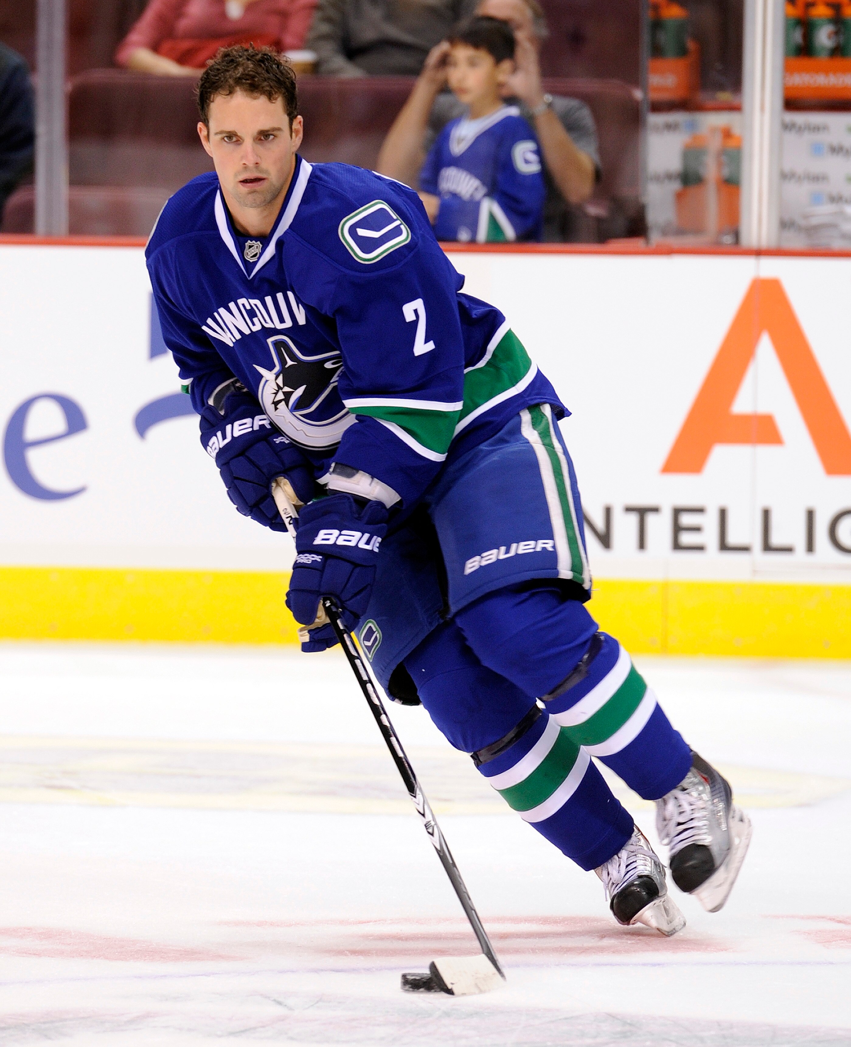 VANCOUVER, CANADA - SEPTEMBER 22: Dan Hamhuis #2 of the Vancouver Canucks takes part in the team warm up prior to NHL pre-season action against the Edmonton Oilers on September 22, 2010 at Rogers Arena in Vancouver, British Columbia, Canada.  (Photo by Ri
