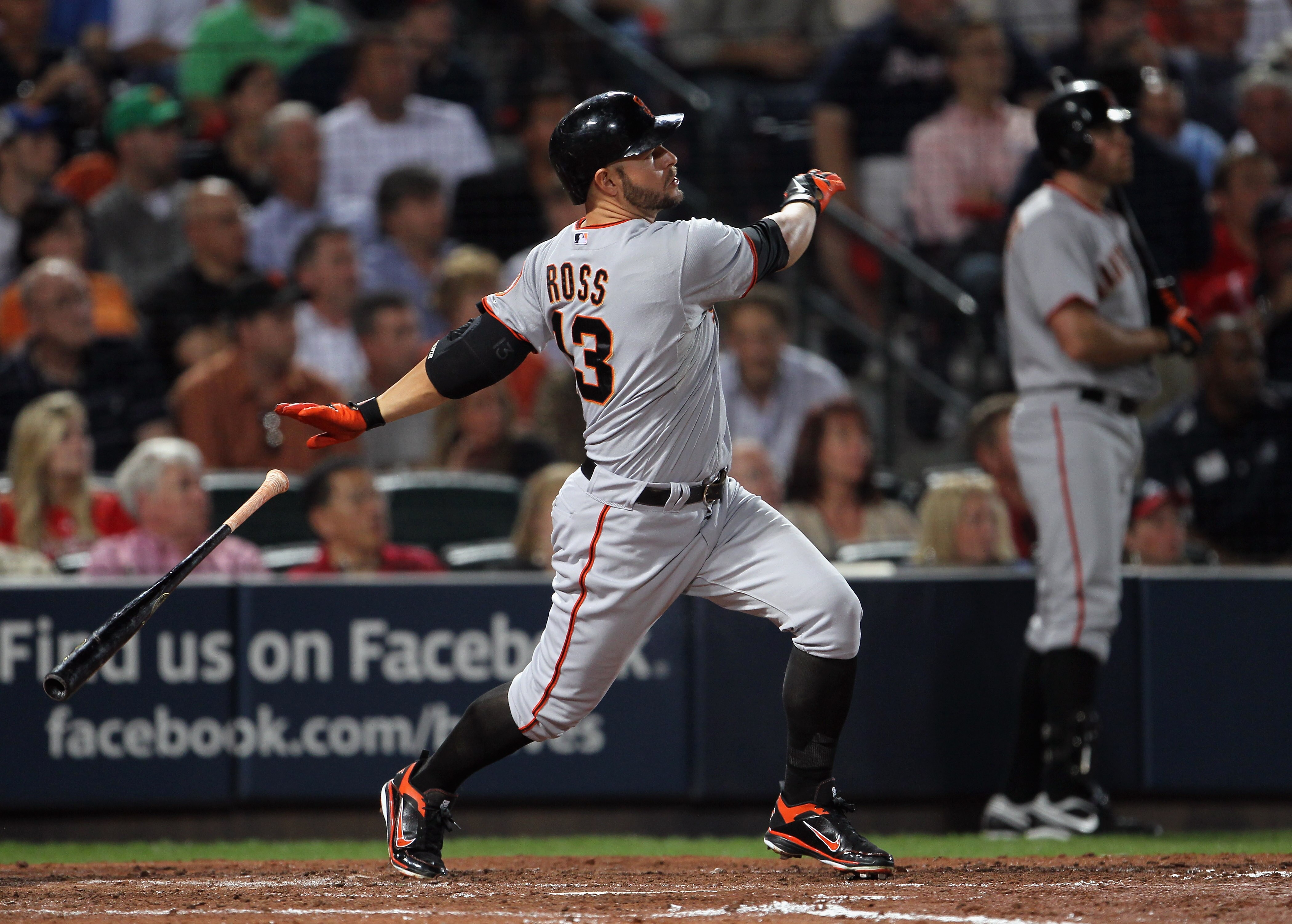 ATLANTA - OCTOBER 11:  Cody Ross #13 of the San Francisco Giants hits a home run during the 6th inning of Game Four of the NLDS of the 2010 MLB Playoffs against the Atlanta Braves on October 11, 2010  at Turner Field in Atlanta, Georgia.  (Photo by Jamie