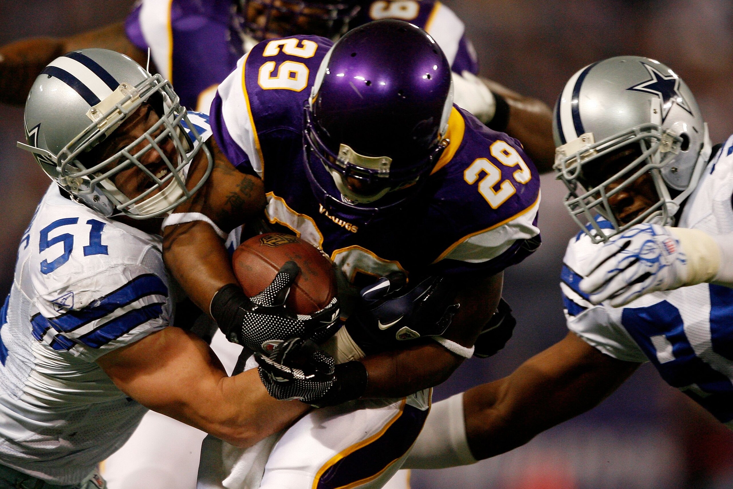 MINNEAPOLIS - JANUARY 17:  Running back Chester Taylor #29 of the Minnesota Vikings is tackled by Keith Brooking #51 of the Dallas Cowboys during the NFC Divisional Playoff Game at Hubert H. Humphrey Metrodome on January 17, 2010 in Minneapolis, Minnesota