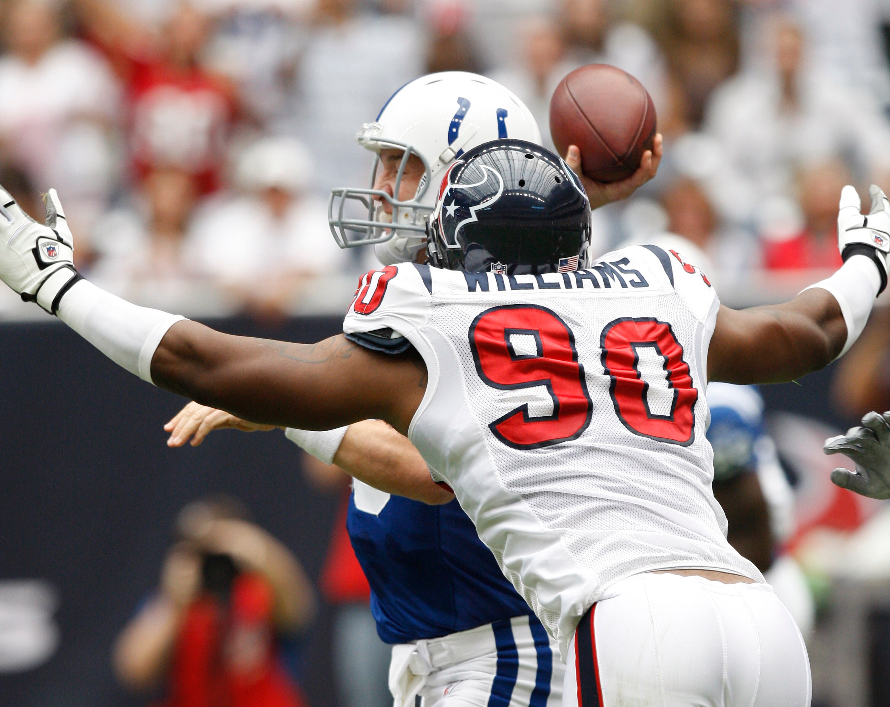 HOUSTON - SEPTEMBER 12:  Defensive end Mario Williams #90 of the Houston Texans applies pressure to quarterback Peyton Manning #18 of the Indianapolis Colts  during the NFL season opener at Reliant Stadium on September 12, 2010 in Houston, Texas.  (Photo 