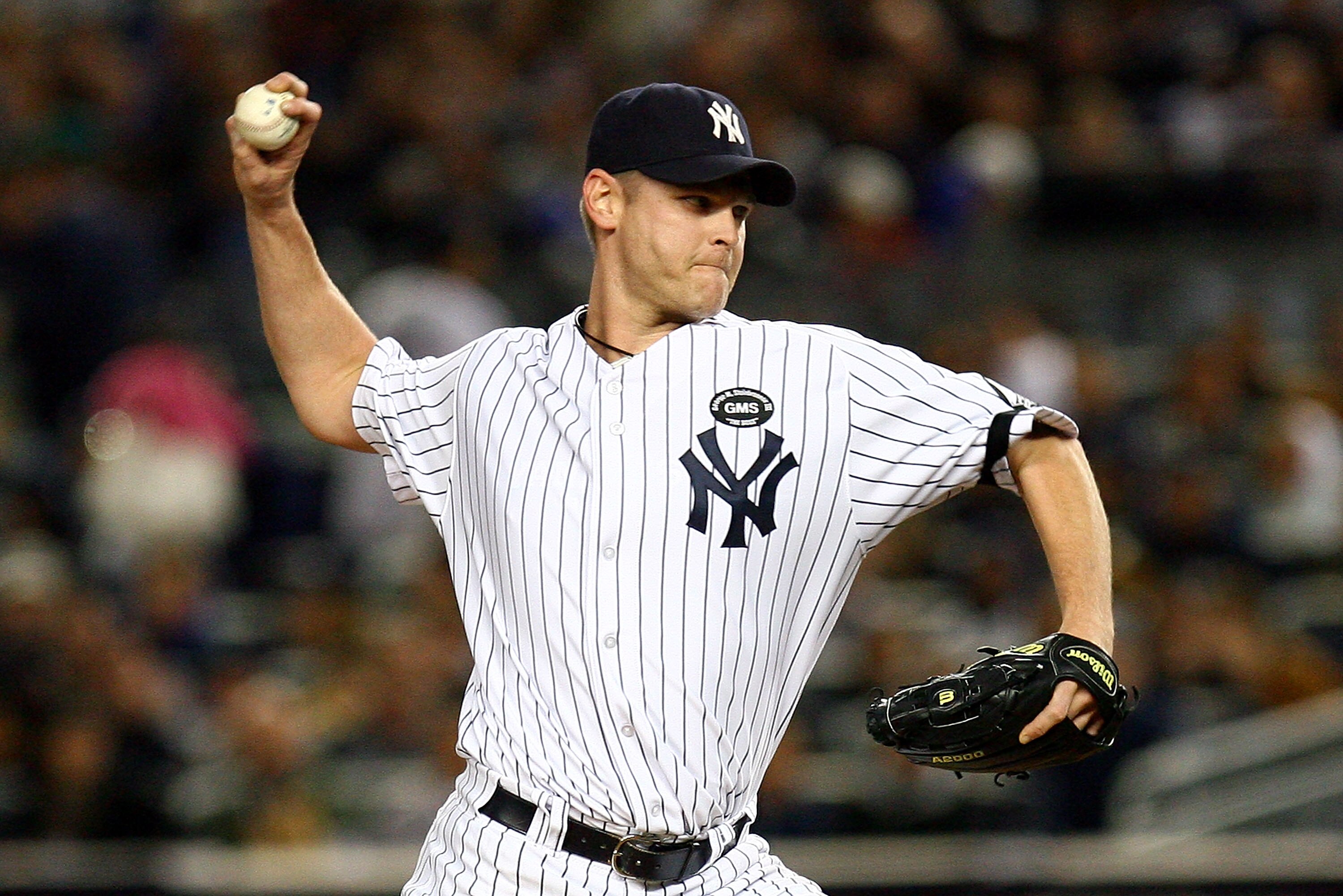 NEW YORK - OCTOBER 09:  Kerry Wood #39 of the New York Yankees throws a pitch against the Minnesota Twins during Game Three of the ALDS part of the 2010 MLB Playoffs at Yankee Stadium on October 9, 2010 in the Bronx borough of New York City.  (Photo by An