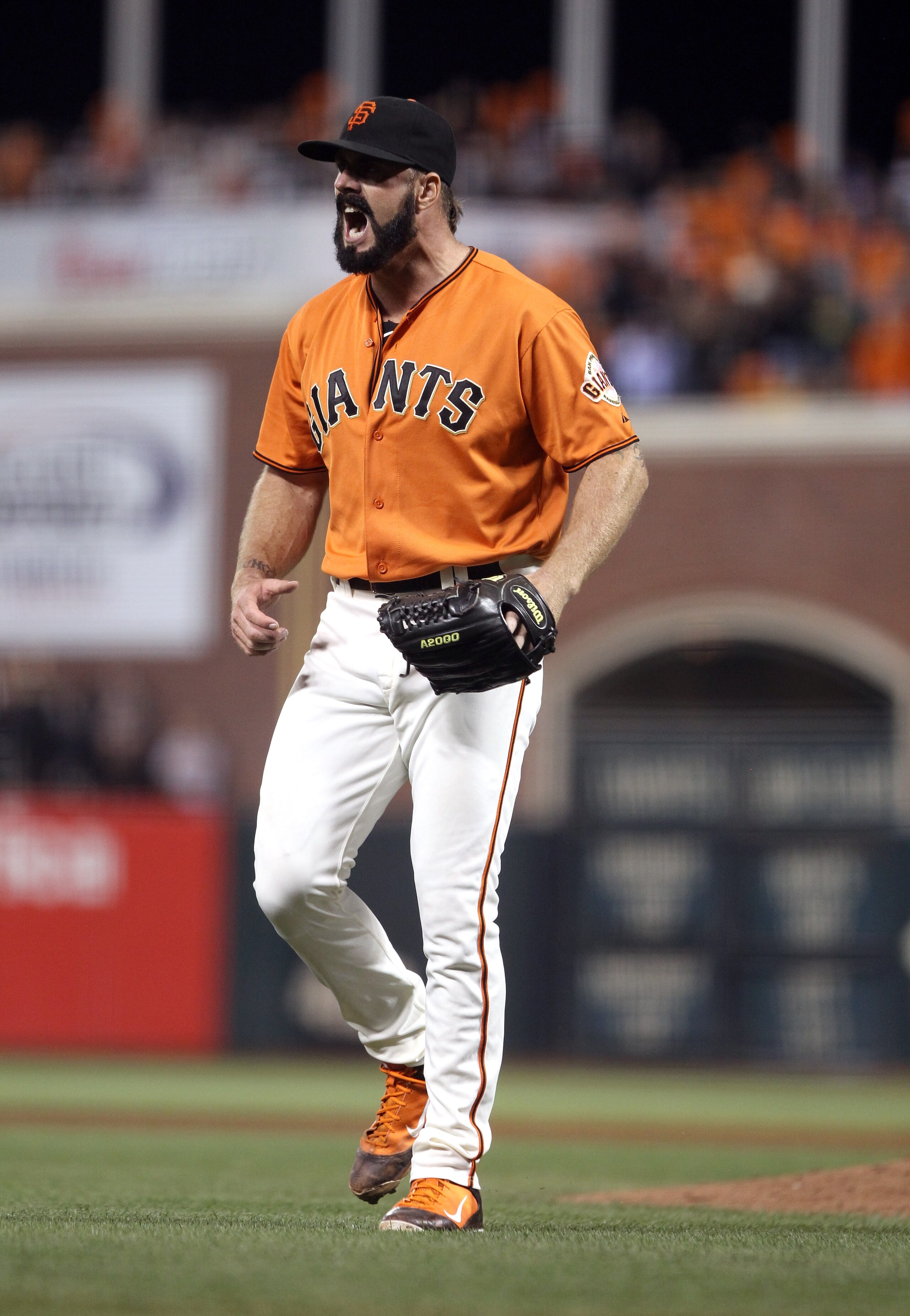 SAN FRANCISCO - OCTOBER 08:  Brian Wilson #38 of the San Francisco Giants reacts as he walks back to the dugout after the end of the ninth inning of their game against the Atlanta Braves in game 2 of the NLDS at AT&T Park on October 8, 2010 in San Francis