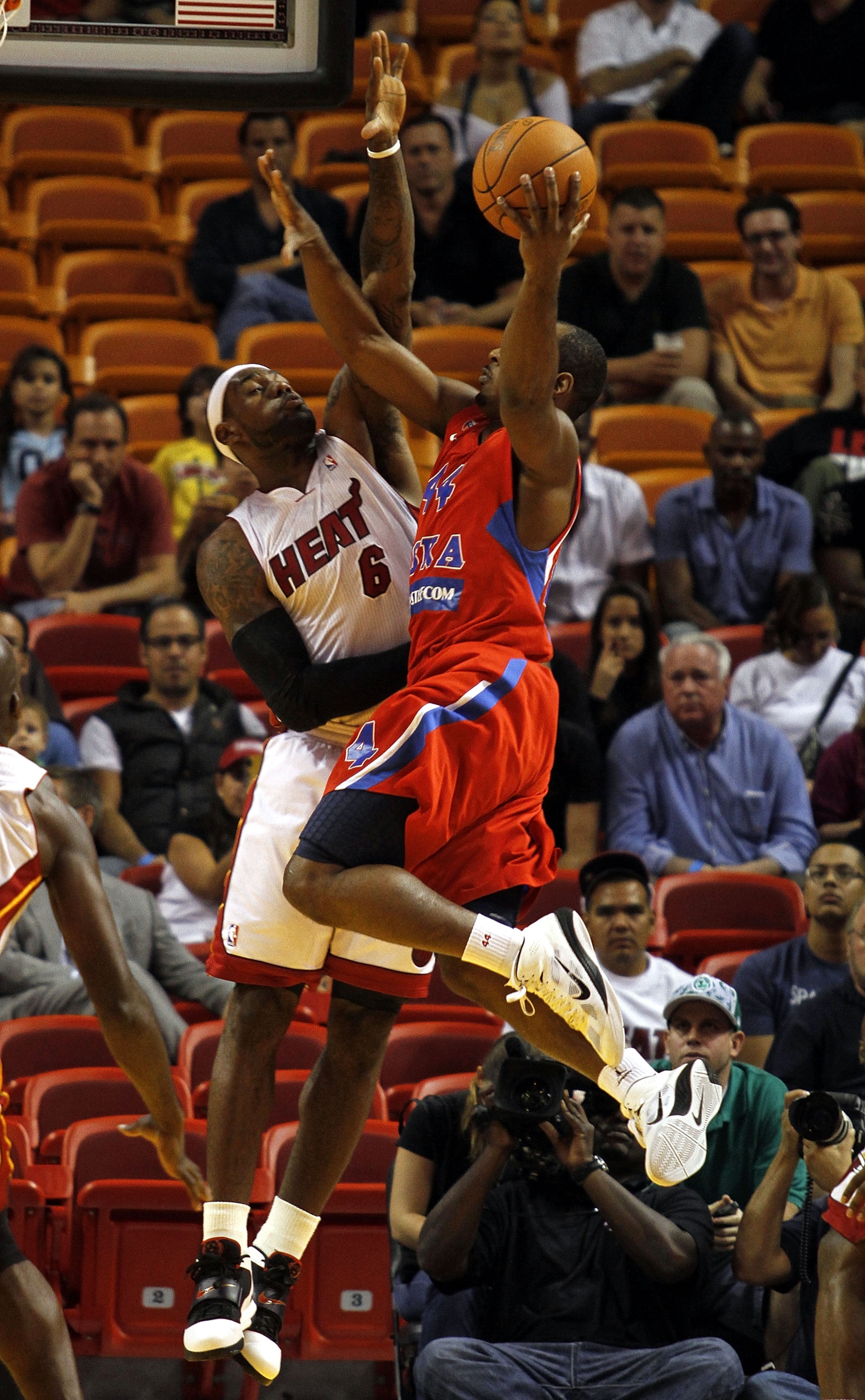 MIAMI - OCTOBER 12:  Forward LeBron James #6 of the Miami Heat defends Guard Jamont Gordon #44 of CSKA Moskow on October 12, 2010 in Miami, Florida.  NOTE TO USER: User expressly acknowledges and agrees that, by downloading and or using this photograph, U