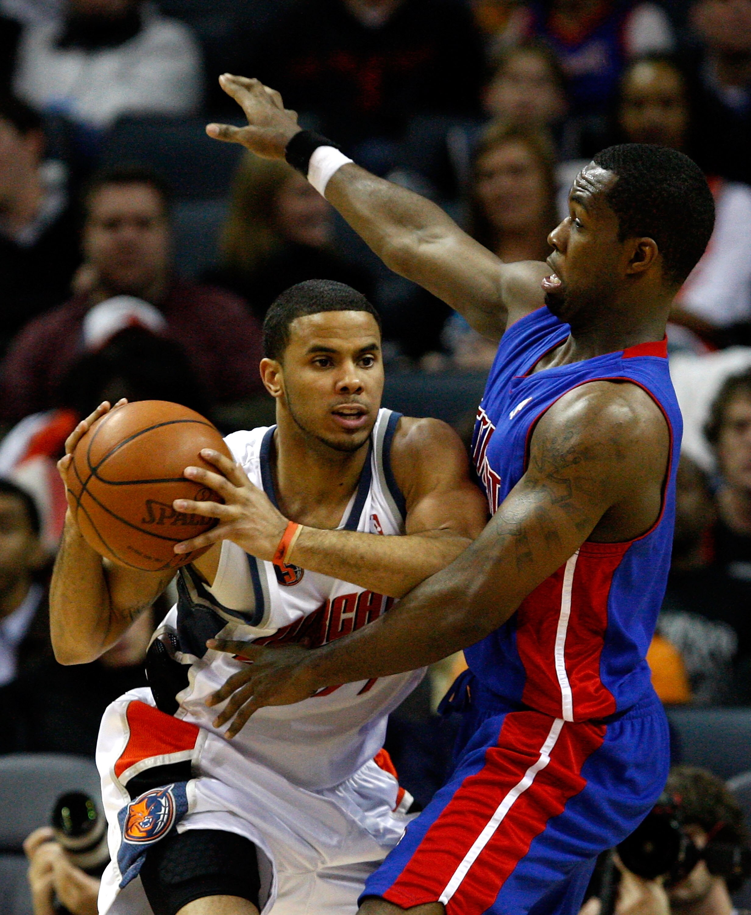 CHARLOTTE, NC - DECEMBER 13:  D.J. Augustin #14 of the Charlotte Bobcats tries to keep the ball away from Rodney Stuckey #3 of the Detroit Pistons during their game at Time Warner Cable Arena on December 13, 2008 in Charlotte, North Carolina.  NOTE TO USE