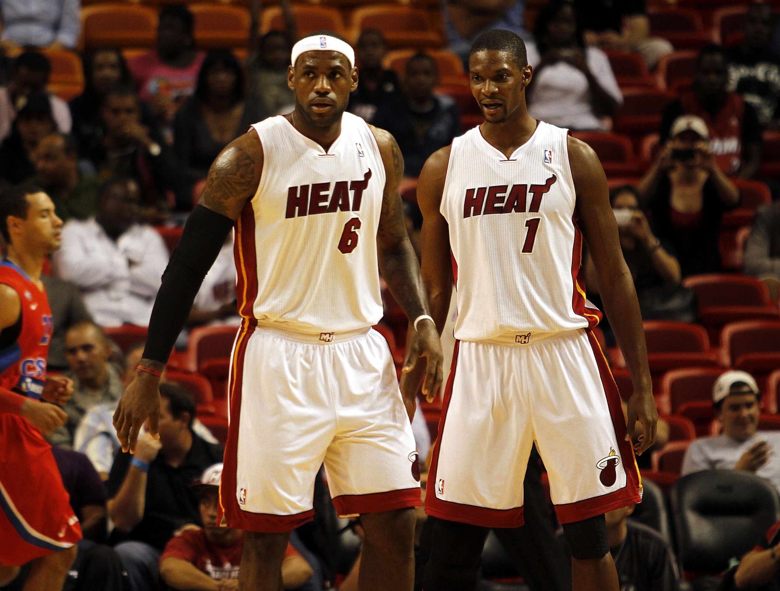 MIAMI - OCTOBER 12:  Forward LeBron James #6 and Chris Bosh #1 of the Miami Heat CSKA Moskow on October 12, 2010 at American Airlines Arena in Miami, Florida.  NOTE TO USER: User expressly acknowledges and agrees that, by downloading and or using this pho