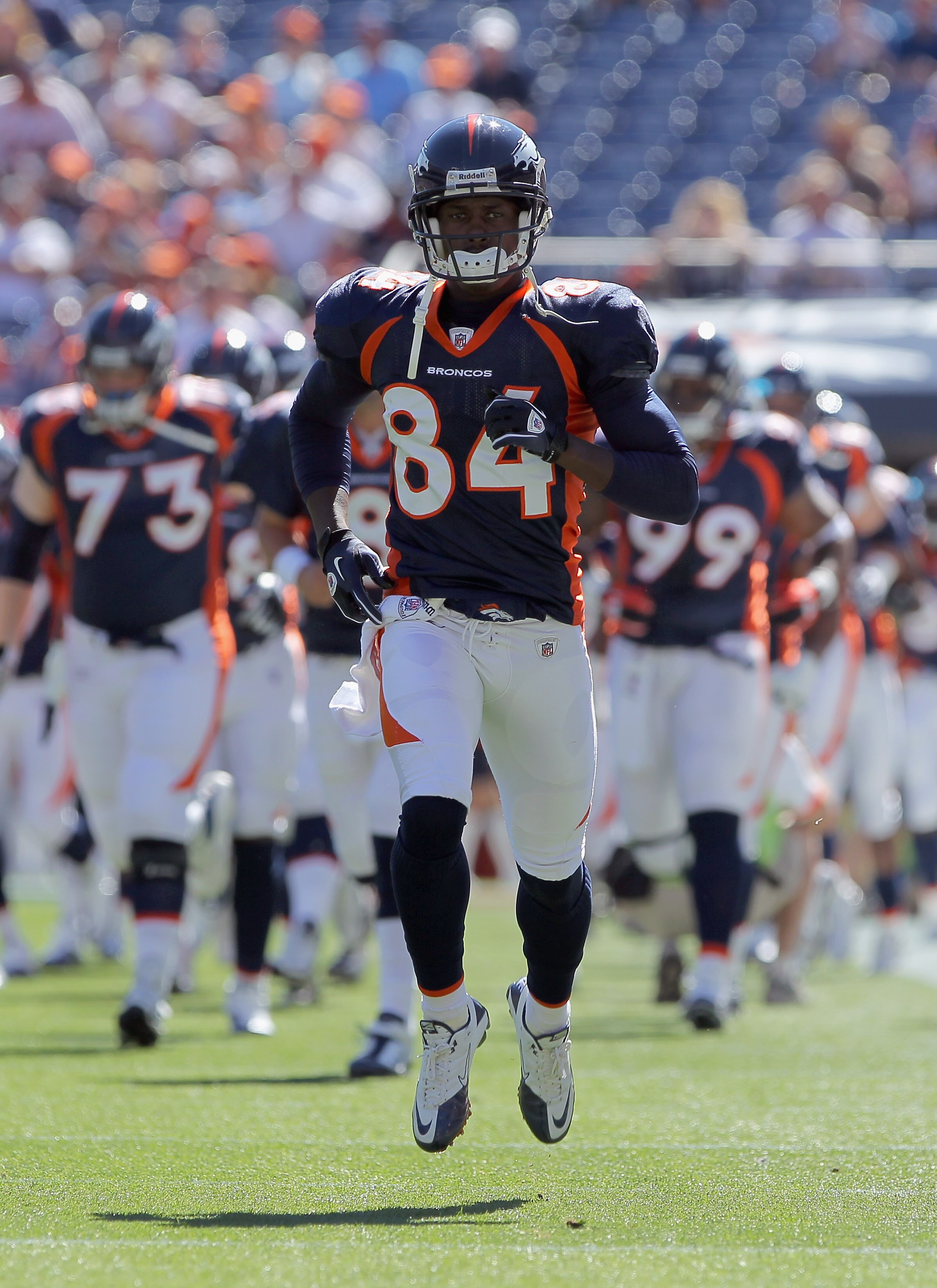 DENVER - SEPTEMBER 26:  Wide receiver Brandon Lloyd #84 and the Denver Broncos take the field to face the Indianapolis Colts at INVESCO Field at Mile High on September 26, 2010 in Denver, Colorado. The Colts defeated the Broncos 27-13.  (Photo by Doug Pen