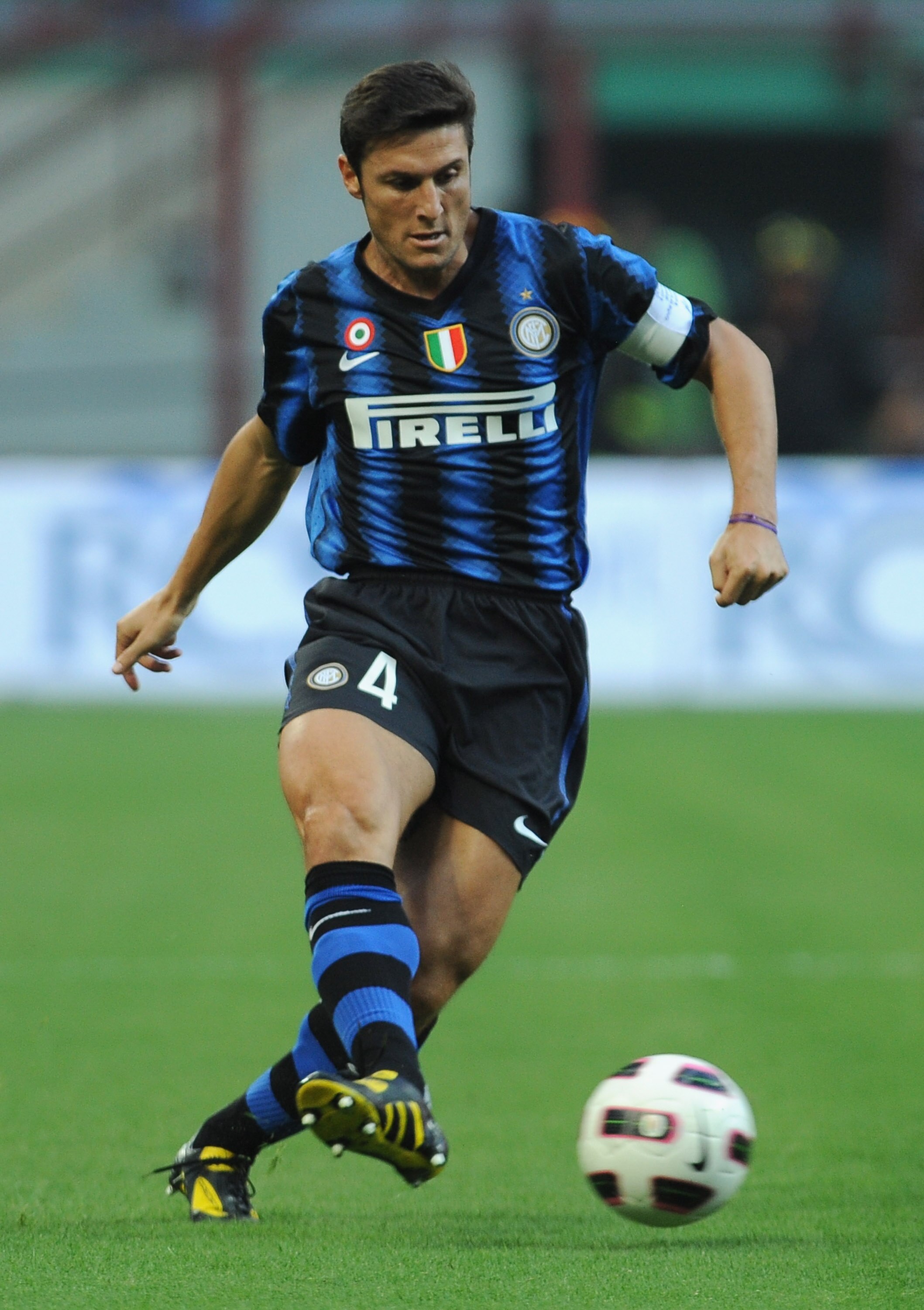 MILAN, ITALY - SEPTEMBER 11:  Javier Zanetti  of FC Internazionale in action during the Serie A match between FC Internazionale and Udinese Calcio at Stadio Giuseppe Meazza on September 11, 2010 in Milan, Italy.  (Photo by Valerio Pennicino/Getty Images)