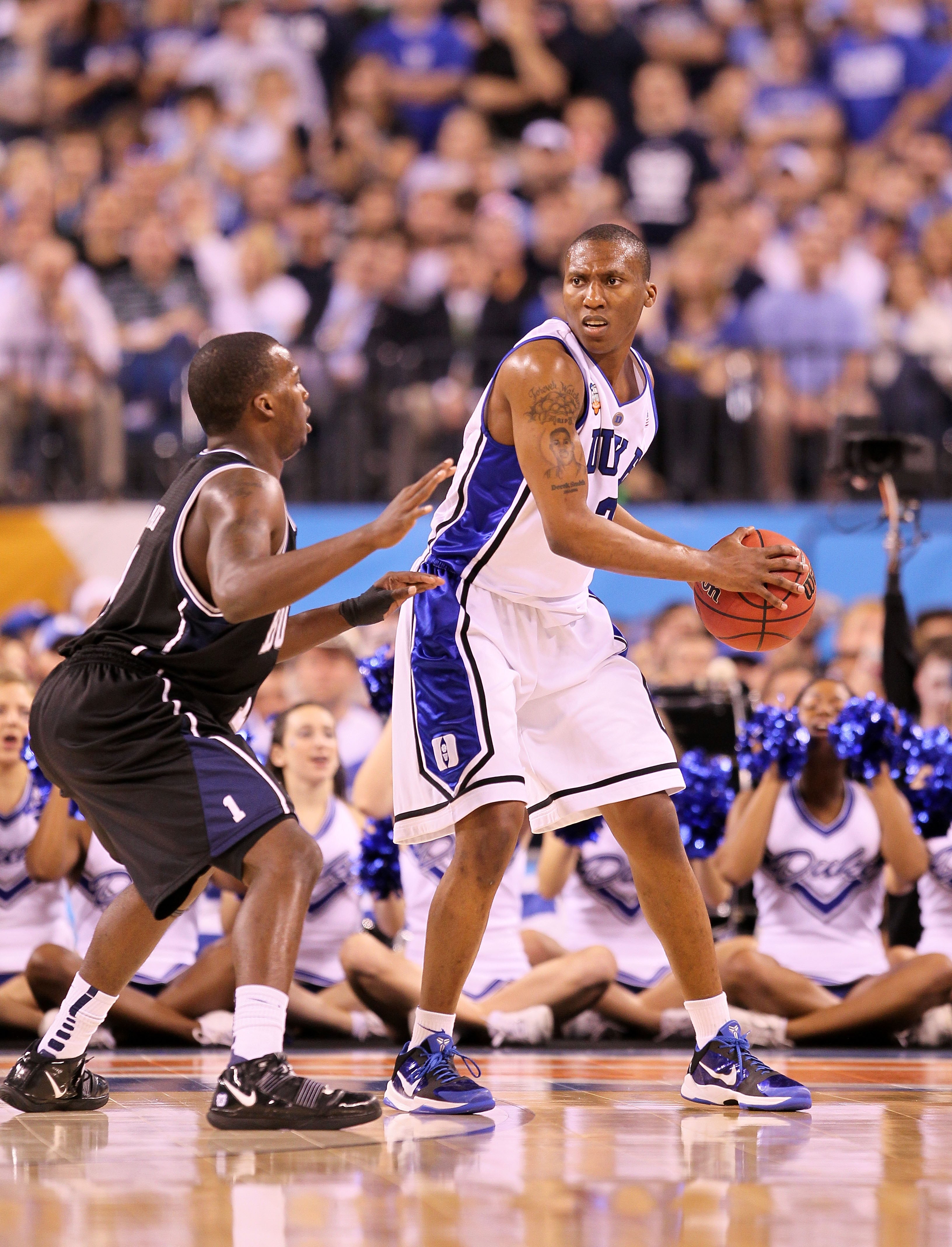 INDIANAPOLIS - APRIL 05:  Nolan Smith #2 of the Duke Blue Devils looks to pass the ball against Shelvin Mack #1 of the Butler Bulldogs during the 2010 NCAA Division I Men's Basketball National Championship game at Lucas Oil Stadium on April 5, 2010 in Ind