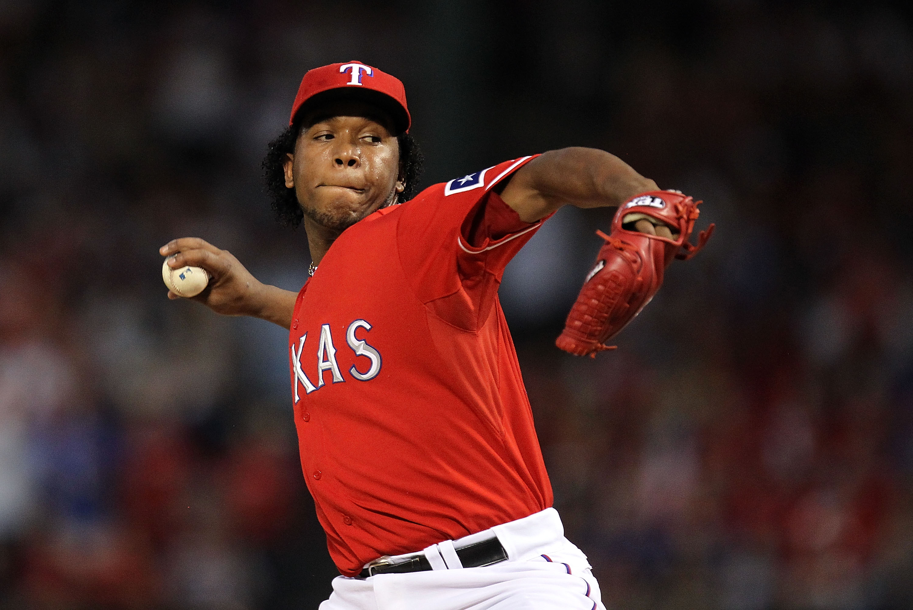 ARLINGTON, TX - OCTOBER 09:  Pitcher Neftali Feliz #30 of the Texas Rangers throws against the Tampa Bay Rays in the 9th inning during game 3 of the ALDS at Rangers Ballpark in Arlington on October 9, 2010 in Arlington, Texas.  (Photo by Ronald Martinez/G