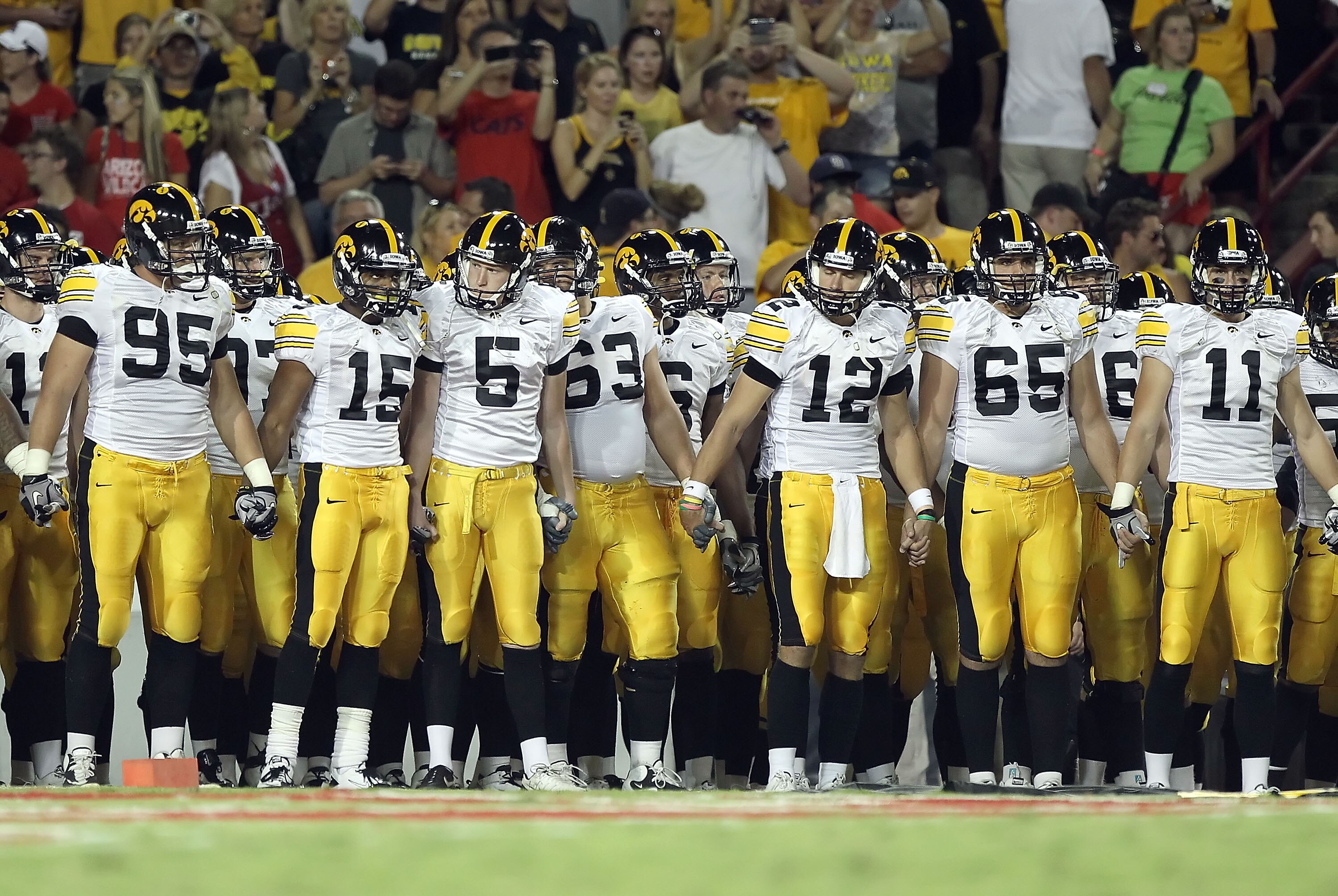 TUCSON, AZ - SEPTEMBER 18:  The Iowa Hawkeyes line up before the college football game against the Arizona Wildcats at Arizona Stadium on September 18, 2010 in Tucson, Arizona. The Wildcats defeated the Hawkeyes 34-27.  (Photo by Christian Petersen/Getty