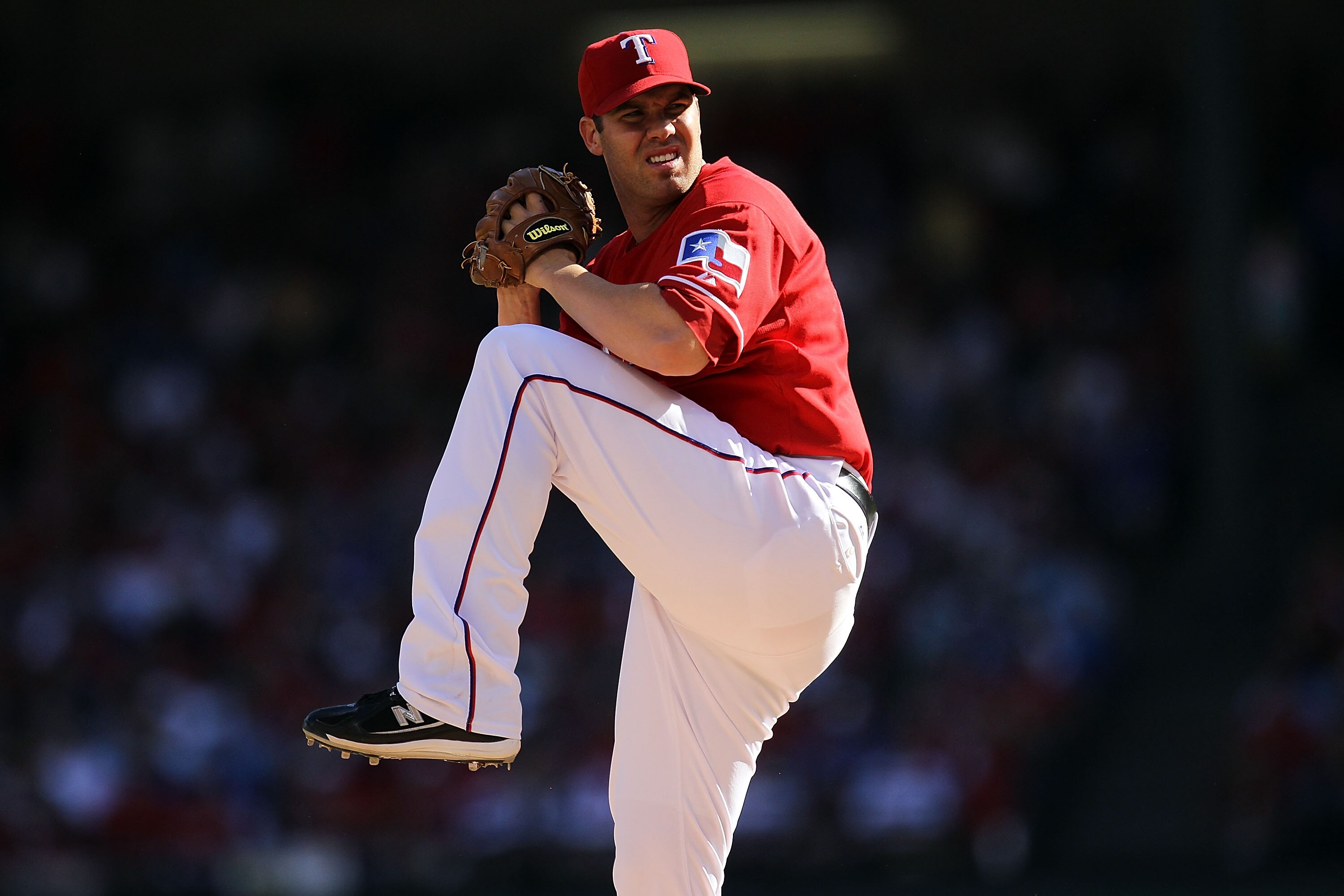 ARLINGTON, TX - OCTOBER 09:  Pitcher Colby Lewis #48 of the Texas Rangers throws against the Tampa Bay Rays during game 3 of the ALDS at Rangers Ballpark in Arlington on October 9, 2010 in Arlington, Texas.  (Photo by Ronald Martinez/Getty Images)