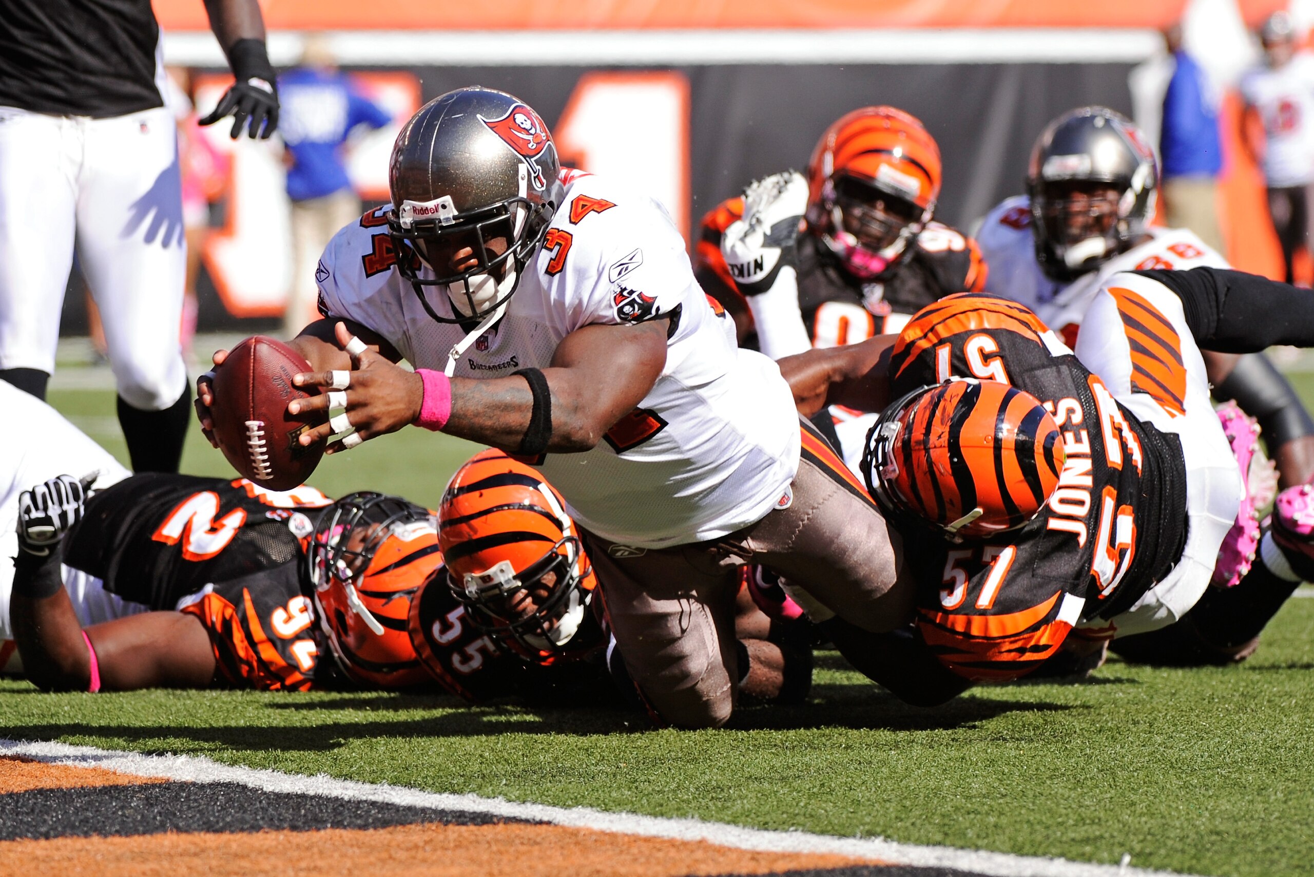 CINCINNATI, OH - OCTOBER 10:  Earnest Graham #34 of the Tampa Bay Buccaneers lunges to cross the goal line for a one-yard touchdown run against the Cincinnati Bengals in the third quarter at Paul Brown Stadium on October 10, 2010 in Cincinnati, Ohio. Tamp