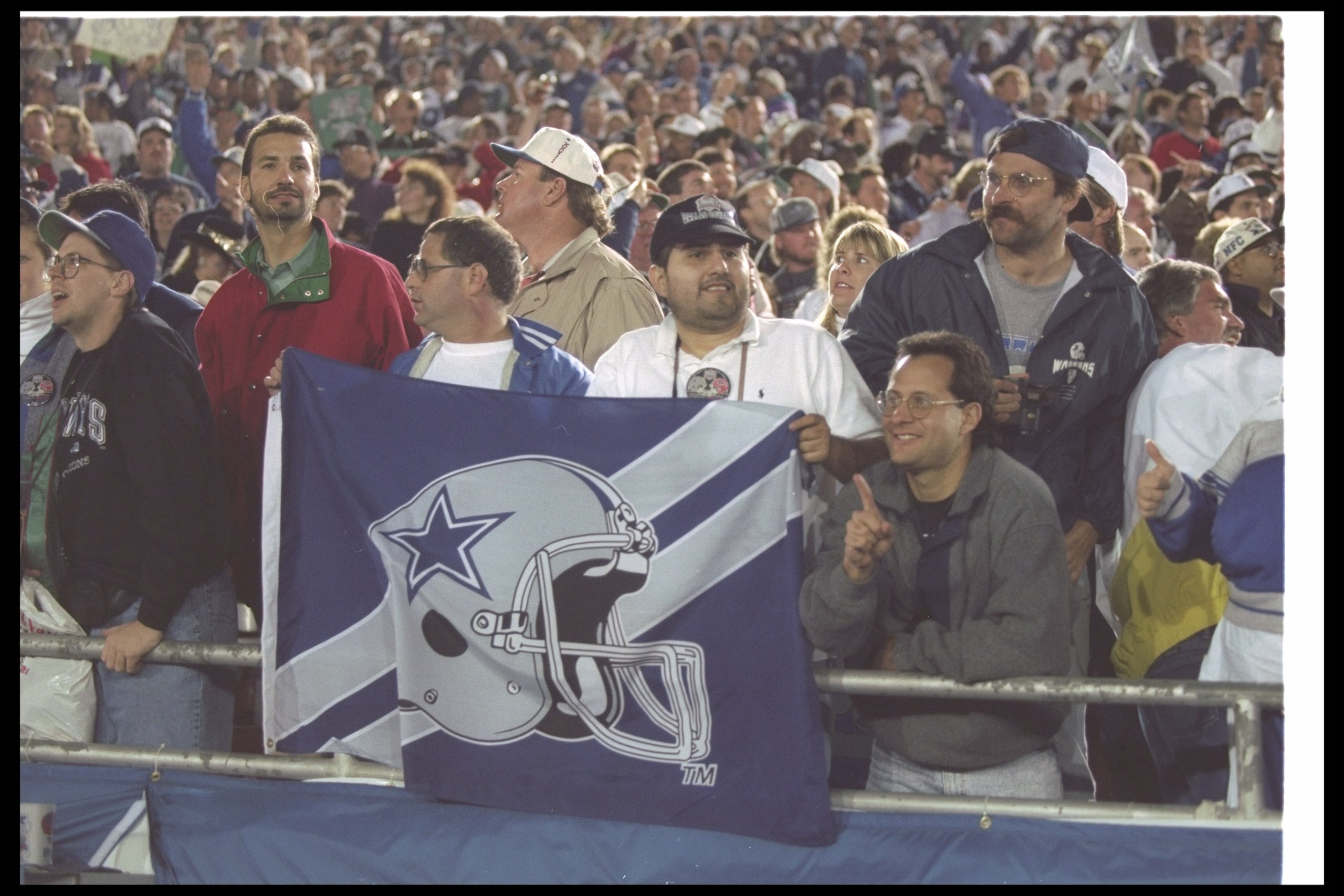 31 Jan 1993:  Dallas Cowboys fans cheer and display a flag during Super Bowl XXVII against the Buffalo Bills at the Rose Bowl in Pasadena, California.  The Cowboys won the game, 52-17. Mandatory Credit: Rick Stewart  /Allsport